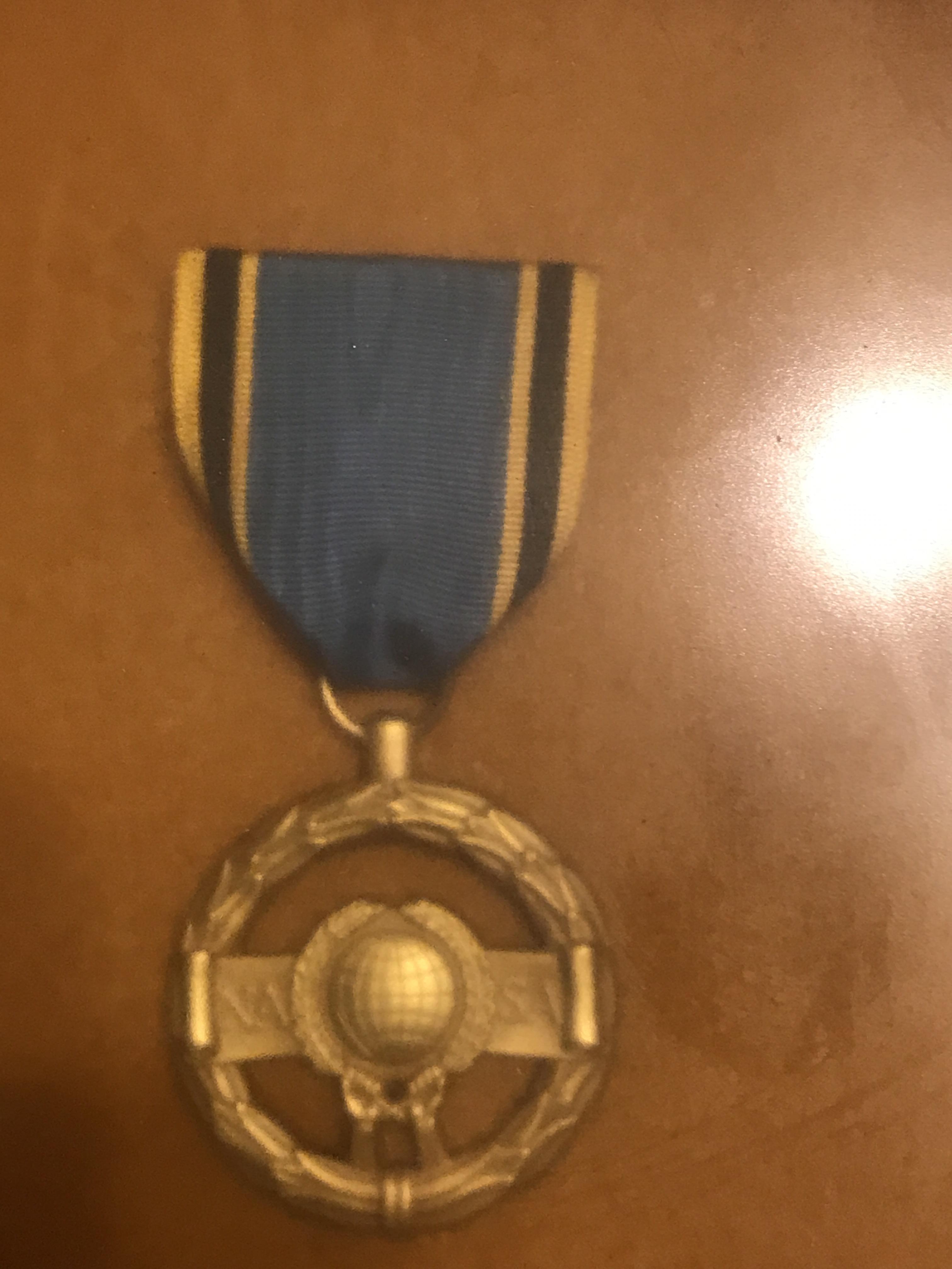 Found this medal cleaning out my Grandfathers house possibly WW2 era