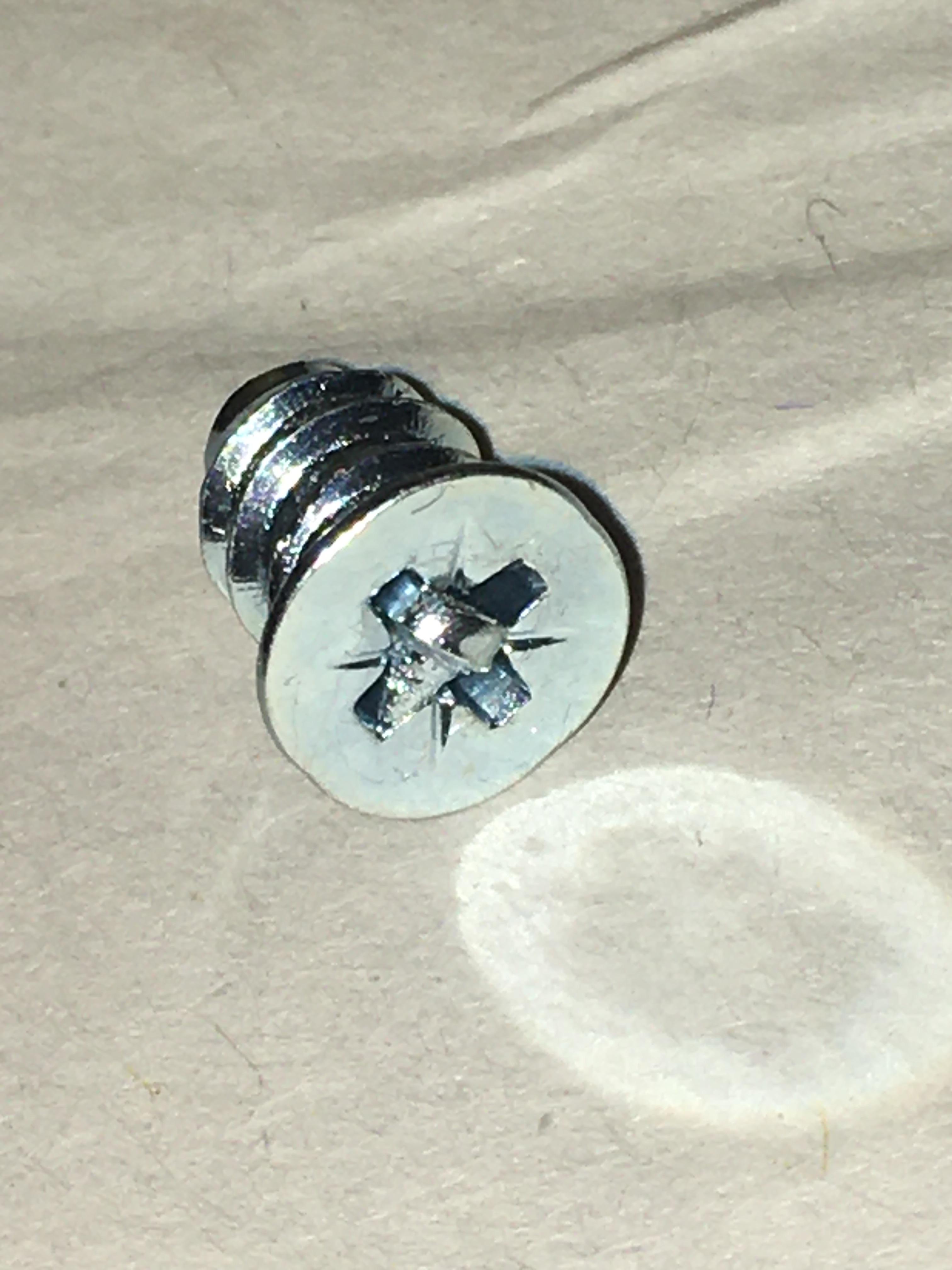 A tiny screw inside my other IKEA screw r/mildlyinteresting