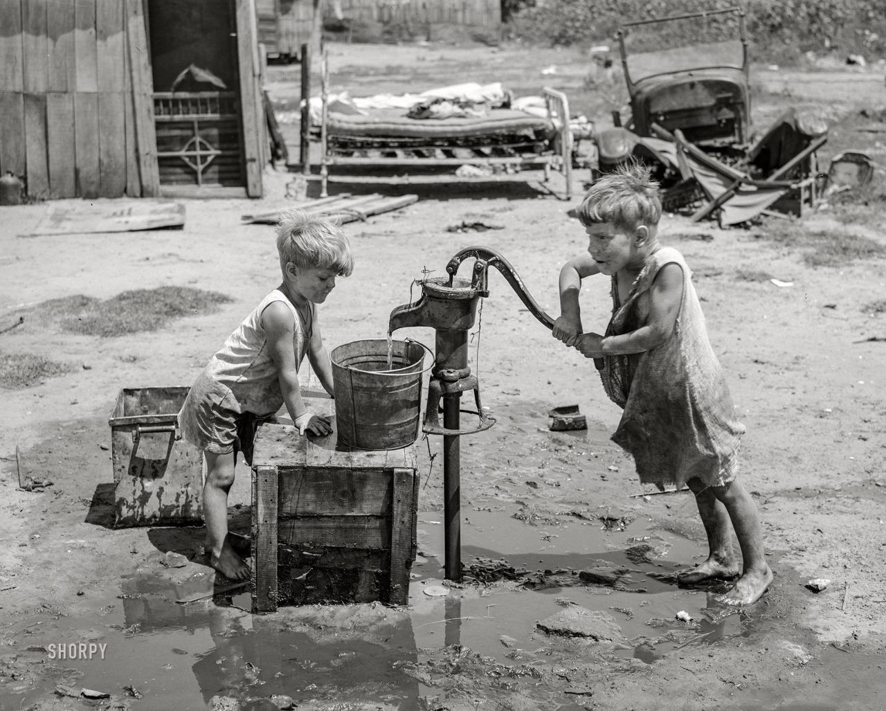 July 1939 Children of May Avenue camp pumping water from a thirtyfoot