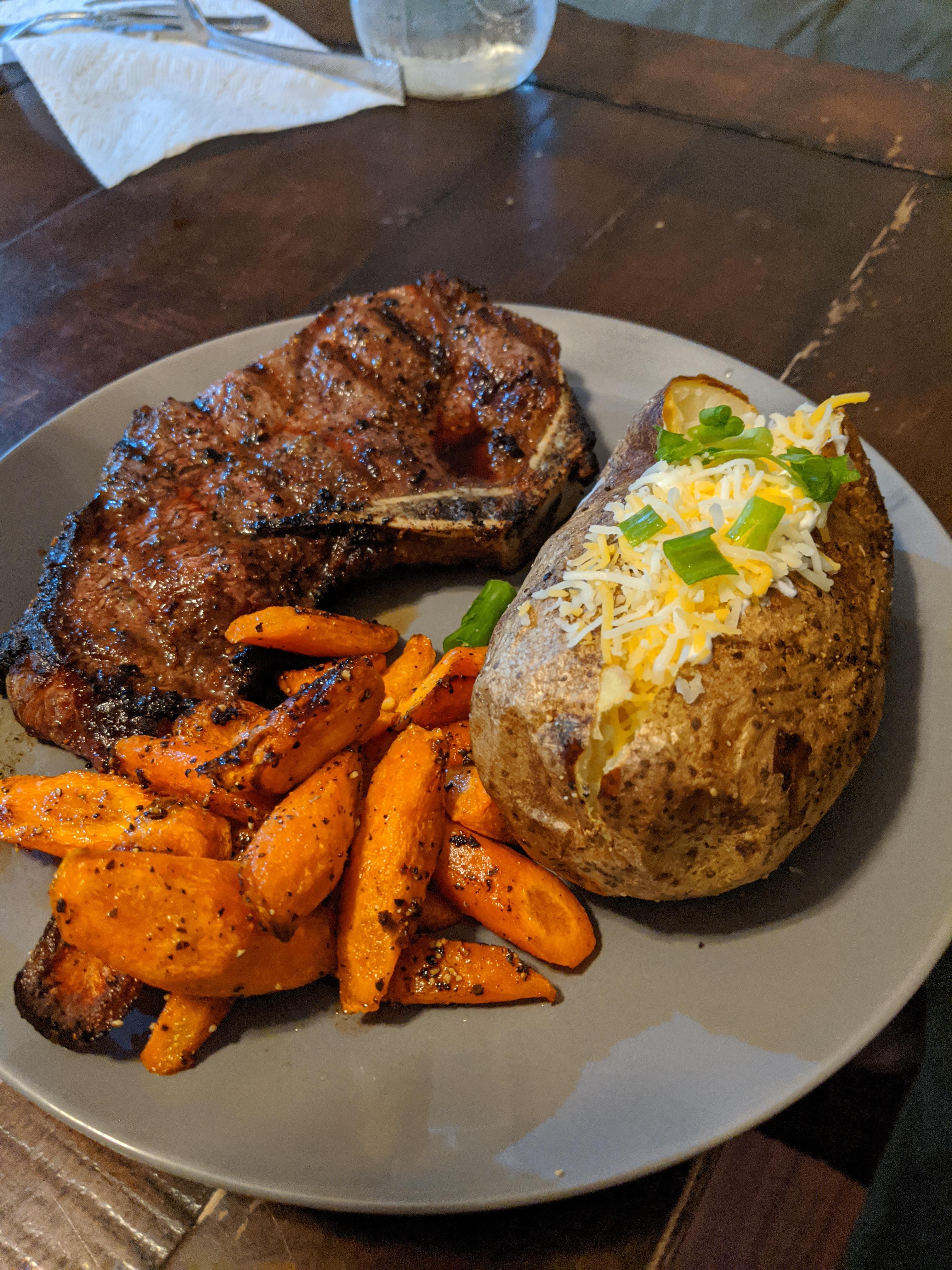 [Homemade] New York steak, baked potatoes, and roasted carrots r/food