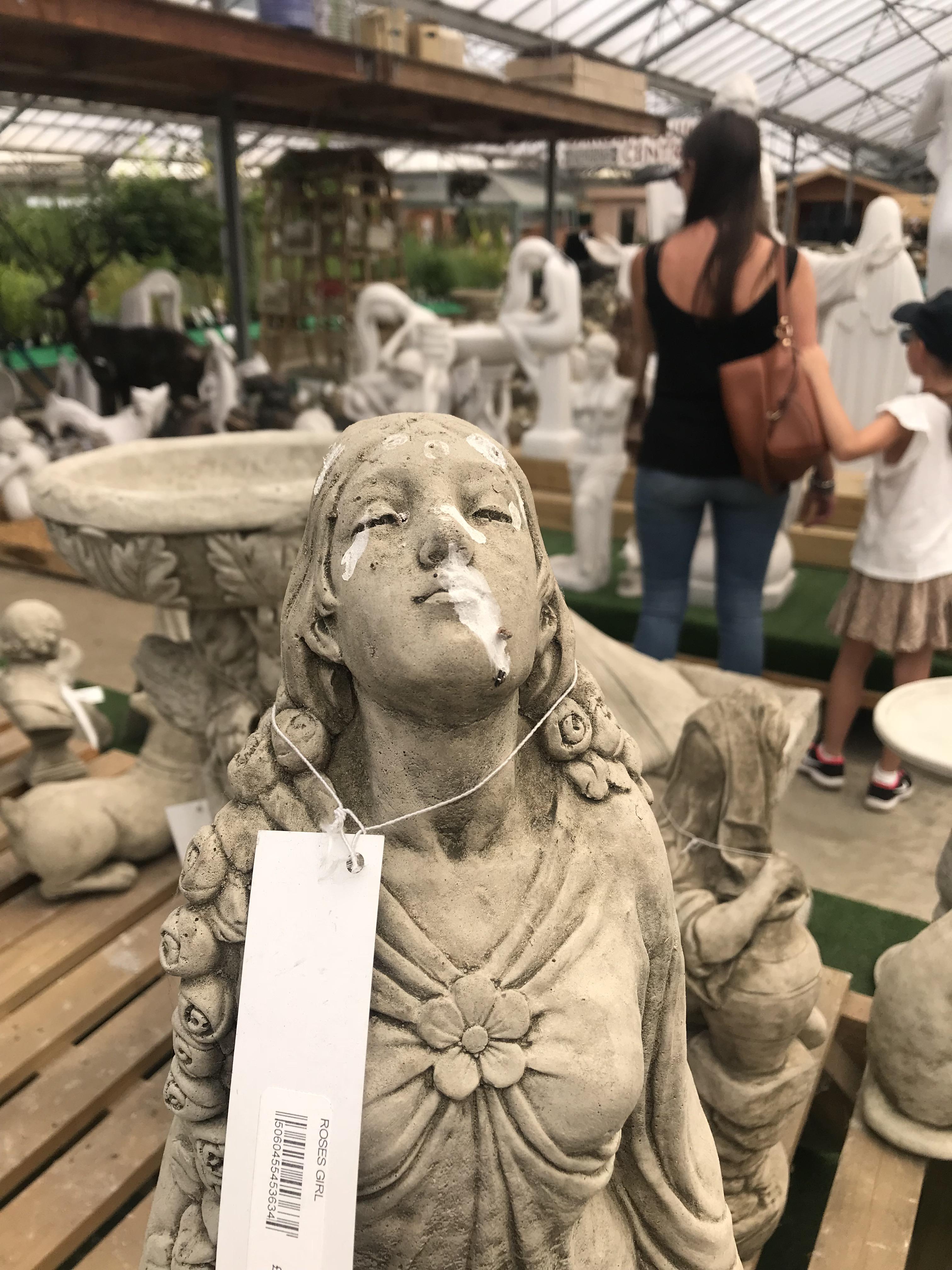 A tasteful garden statue up for grabs in a Sussex garden centre r