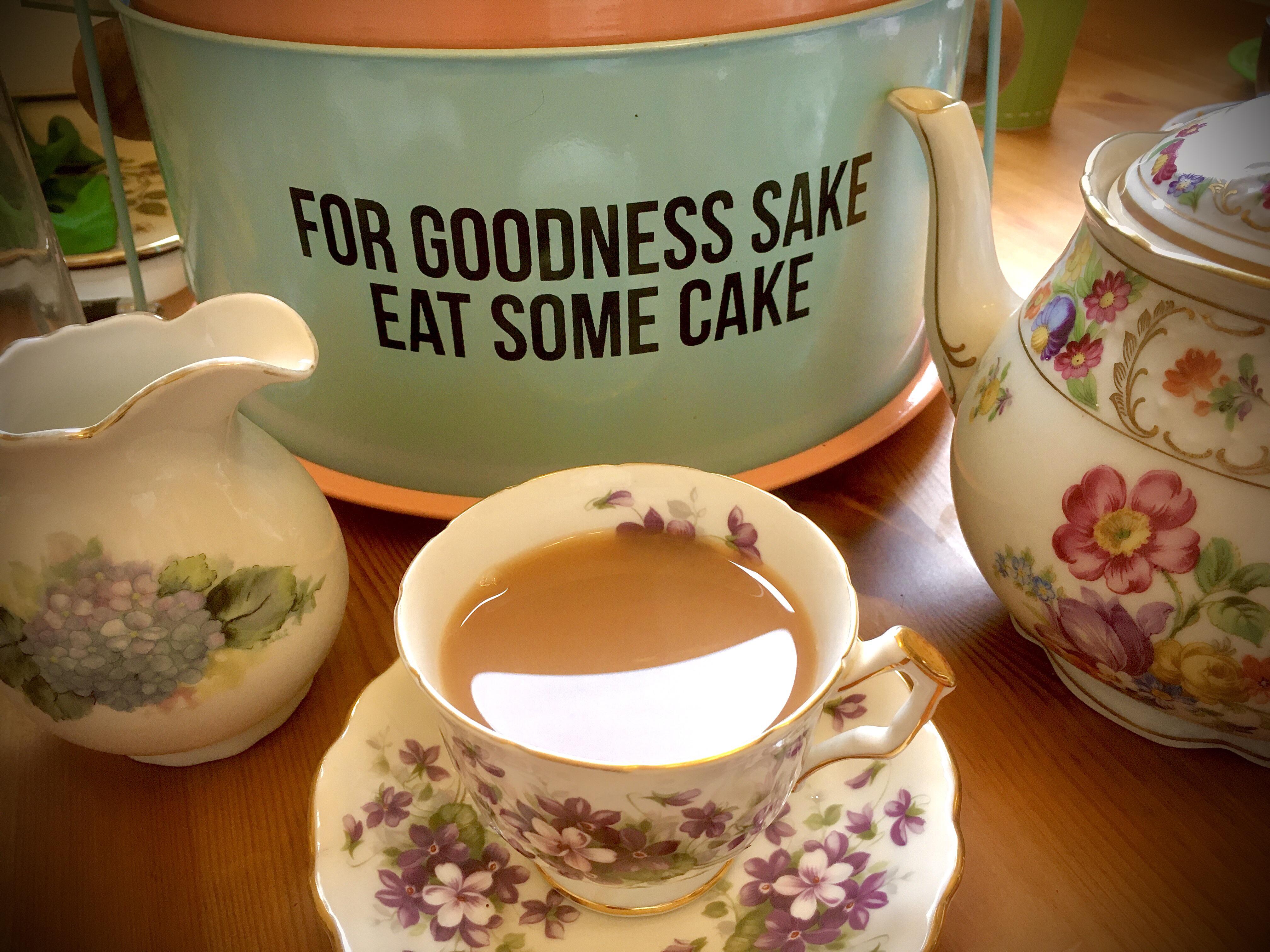 Enjoying Earl Grey Cream tea for breakfast. The cake tin holds a cake I