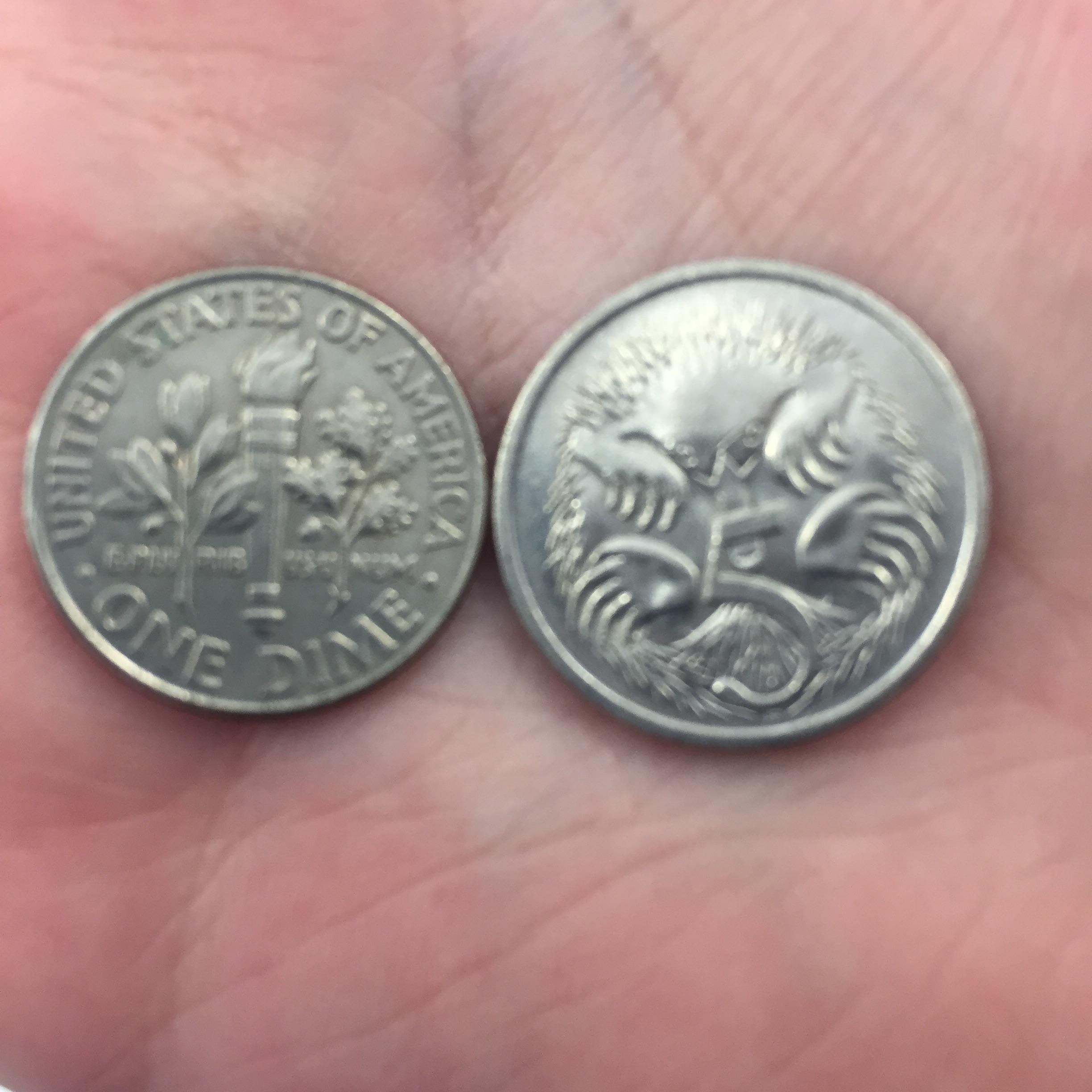 Size comparison; one American dime to 5 Australian cents r/pics