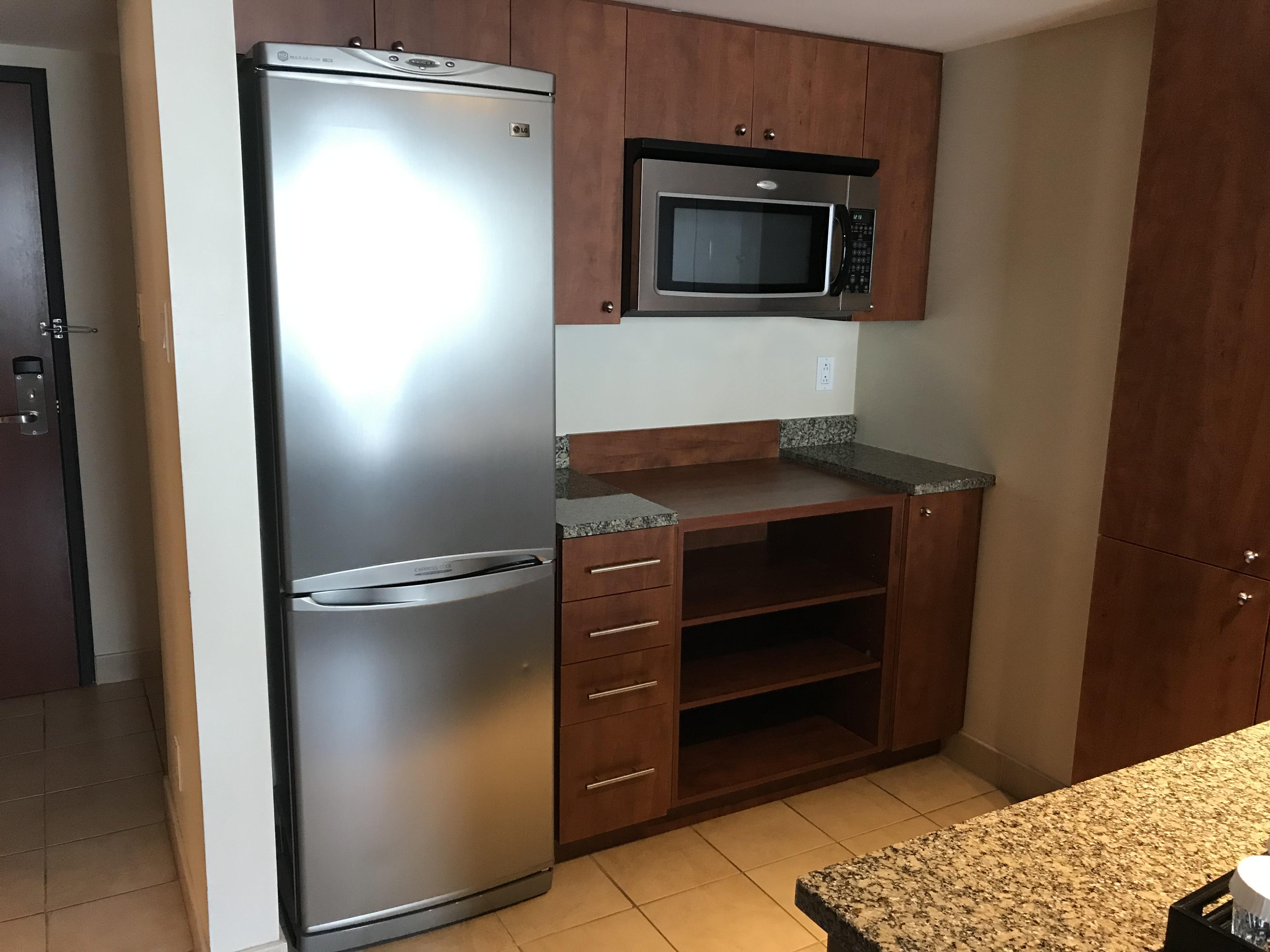 The kitchen in my hotel room has a where the oven/stove should