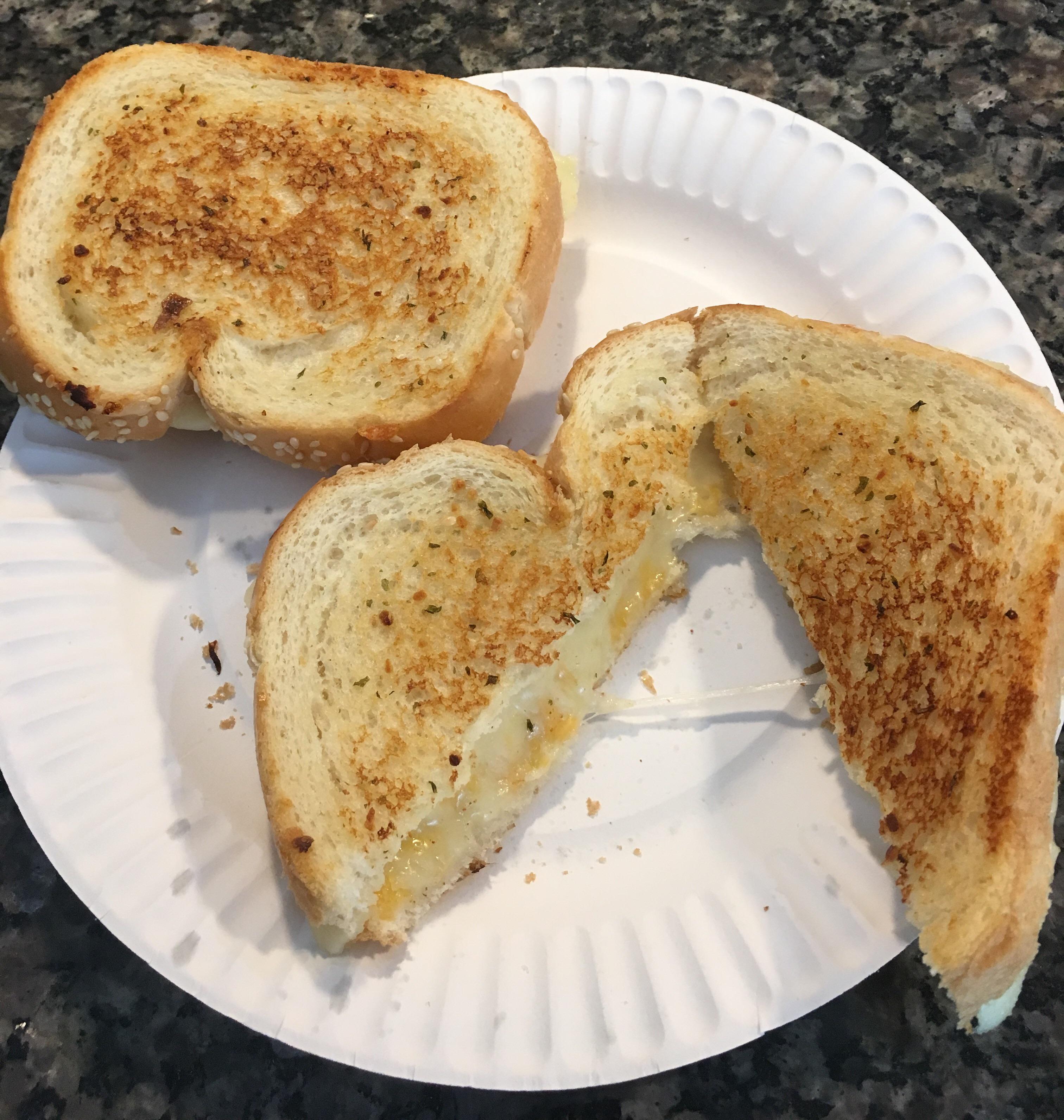 Monterey jack, cheddar, & American on Italian bread with sesame seeds