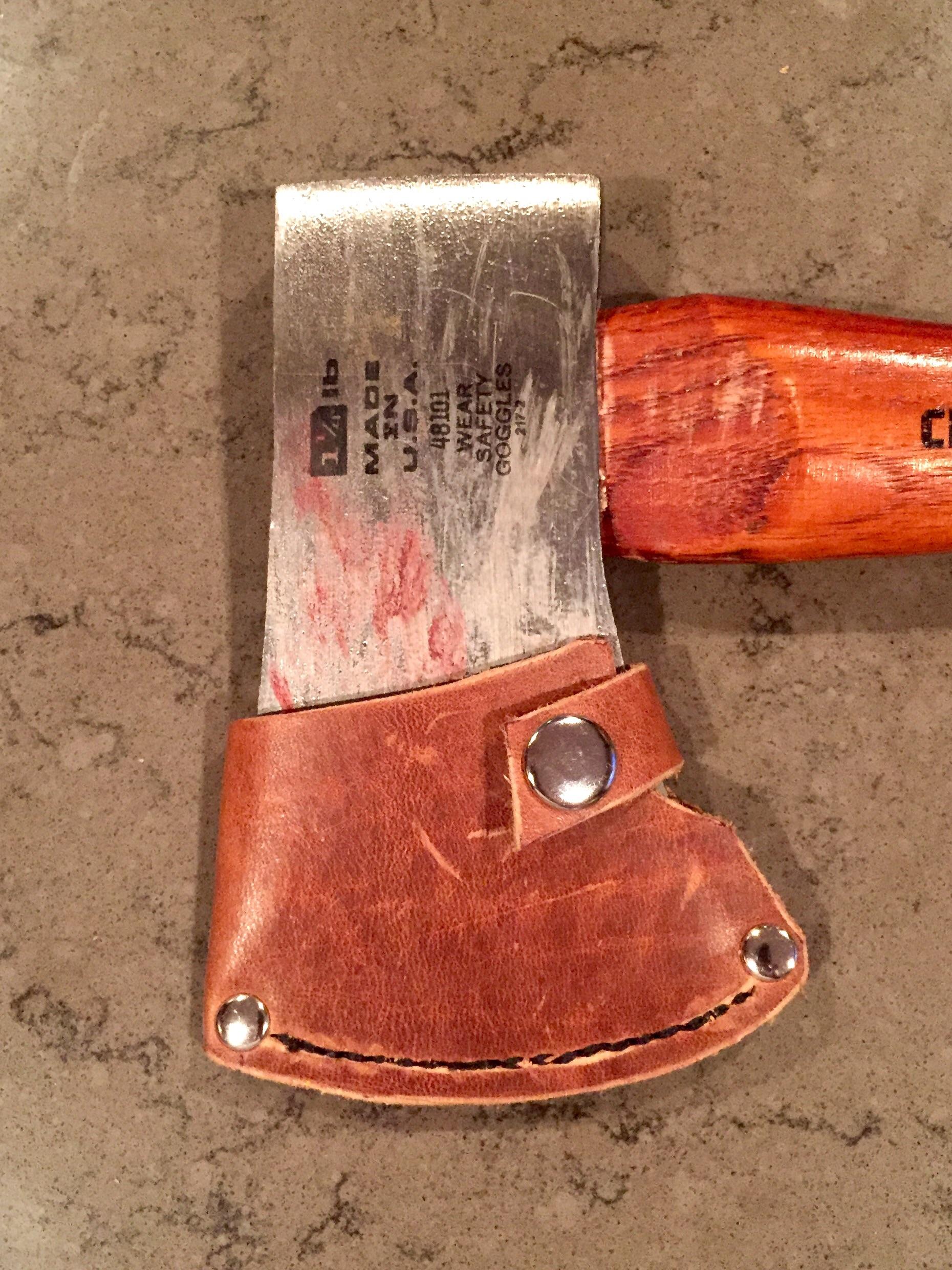 My third leather project, a sheath for my camp axe. Turned out ok! r