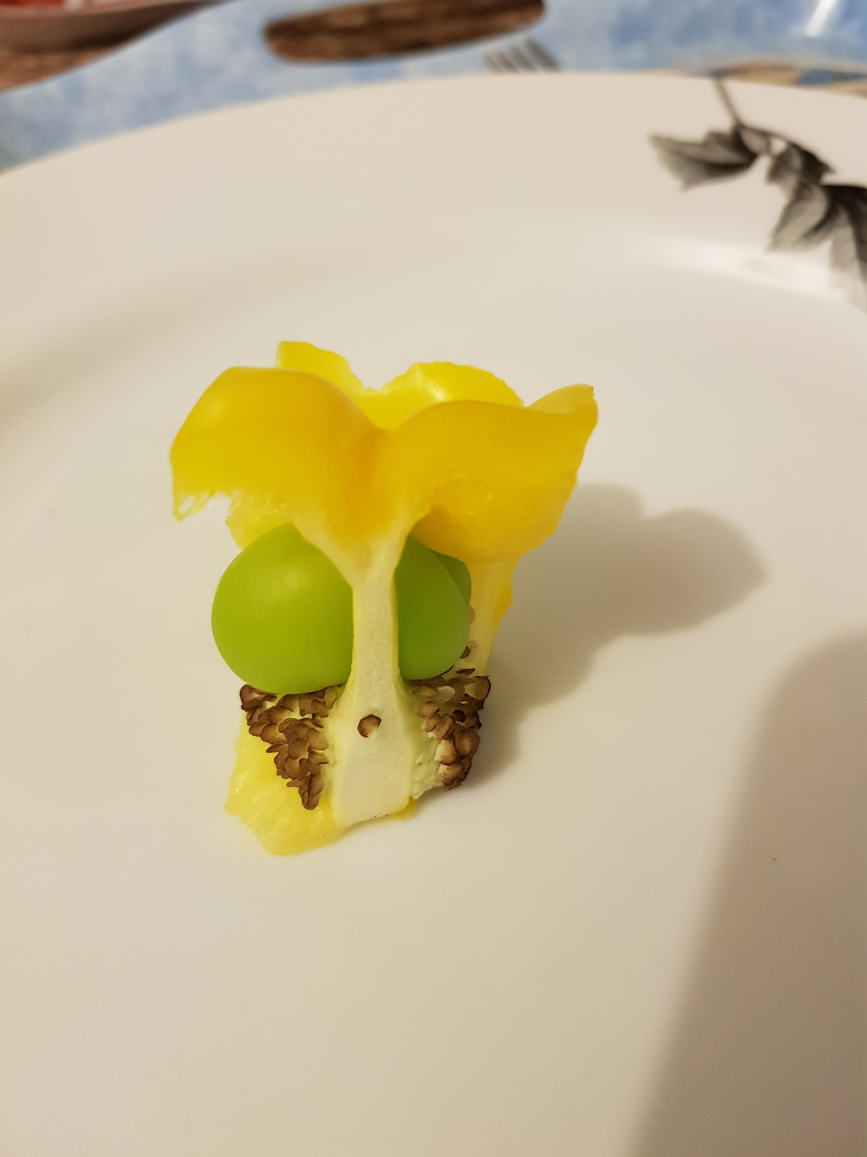 A green pepper growing inside of a yellow pepper. r/mildlyinteresting