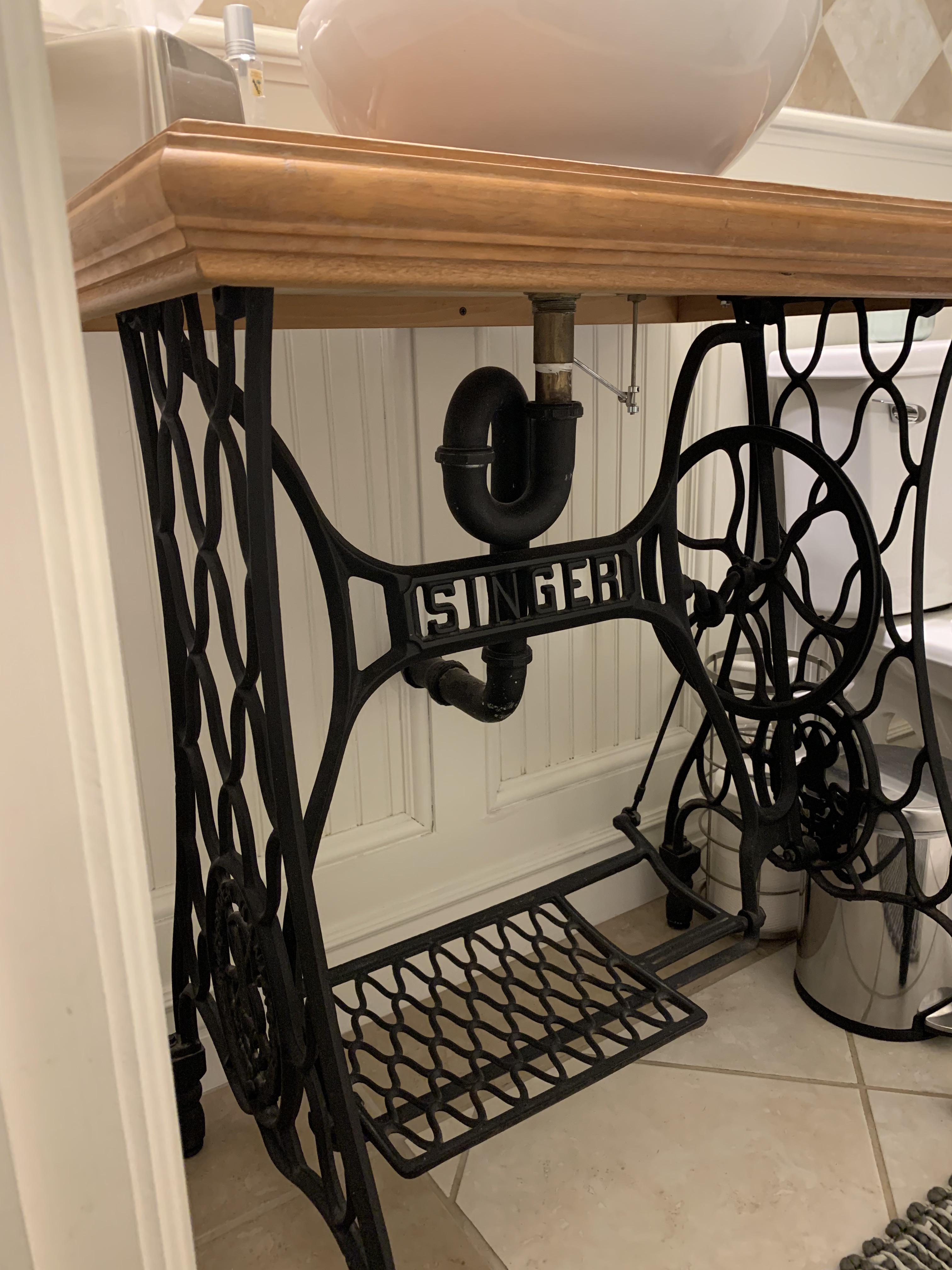 My house has a bathroom sink made of an antique sewing machine