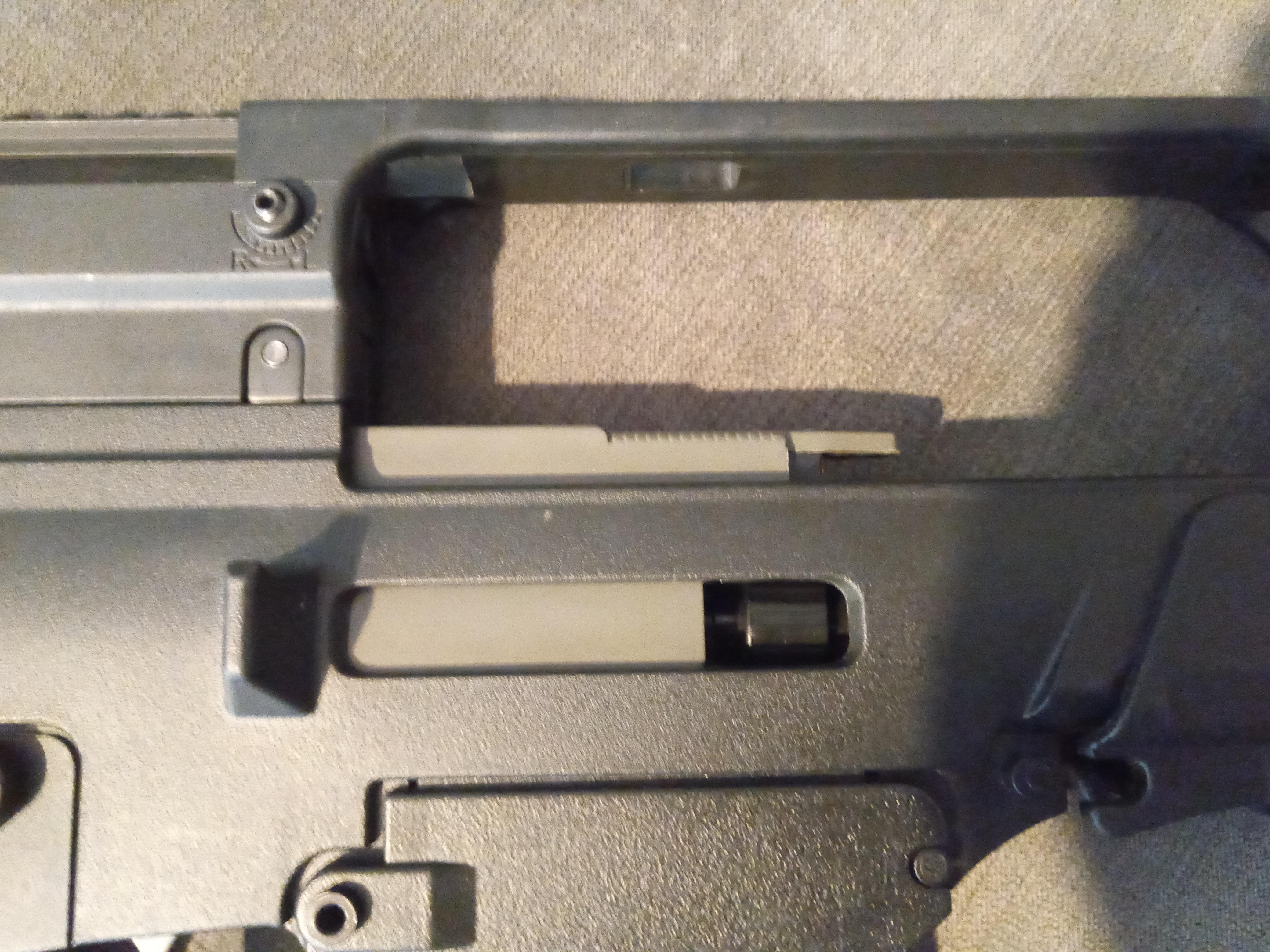 My Ares As36k's bolt is stuck. Lock bolt is off but it is stuck in this