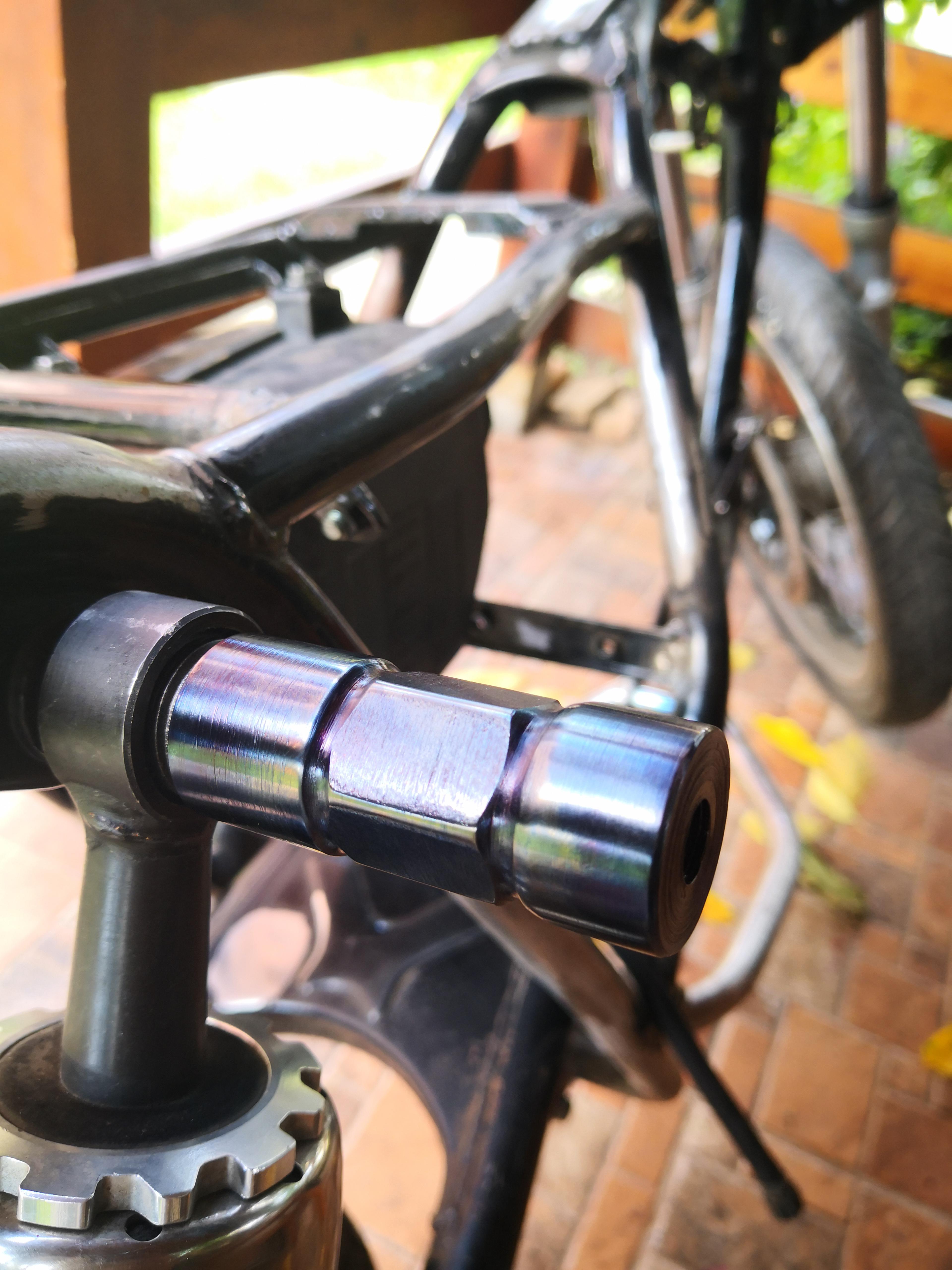 I made this motorcycle exhaust hanger out of a solid steel round bar