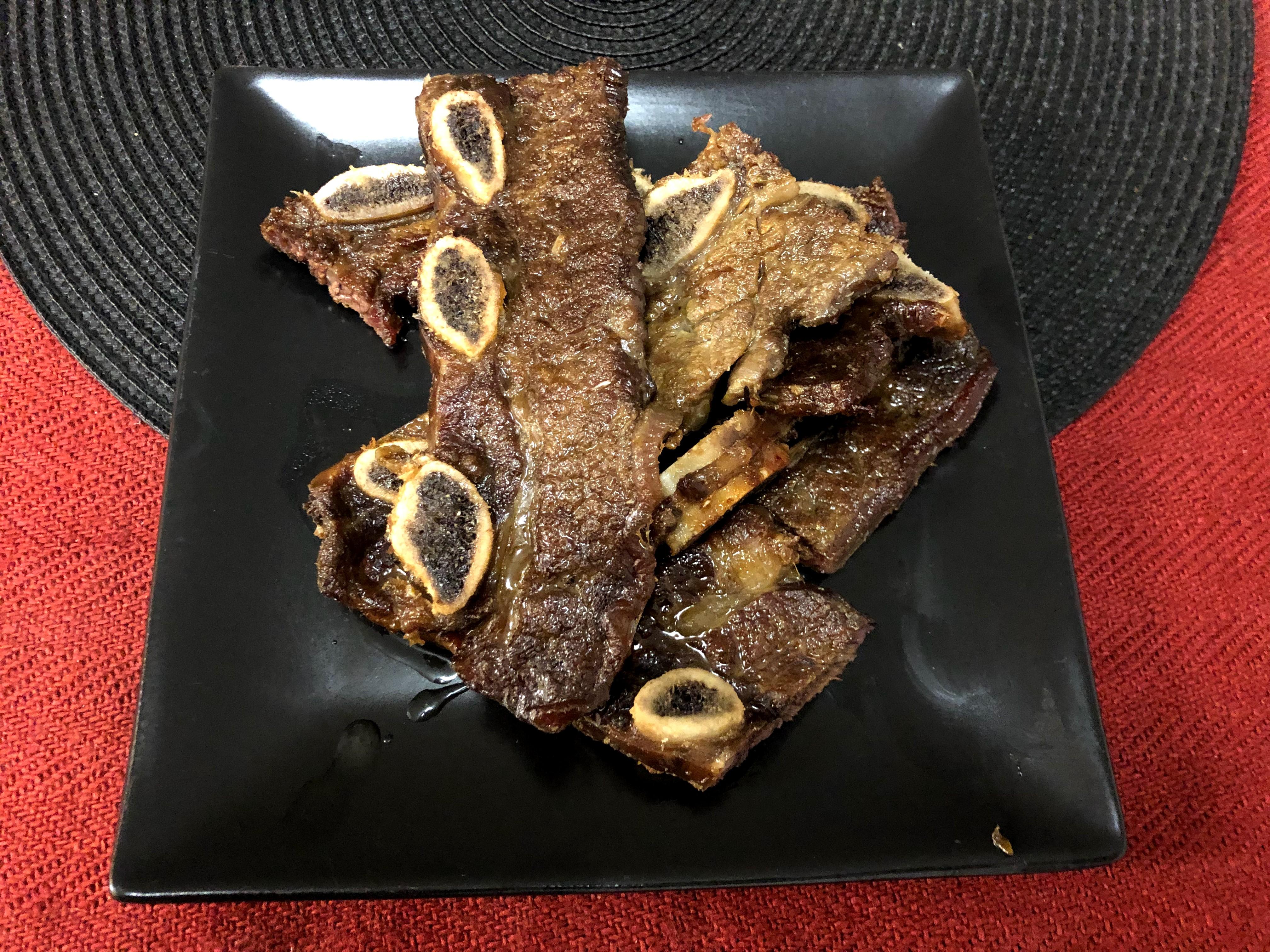 Beef ribs seared then slow cooked in the oven with garlic, olive oil