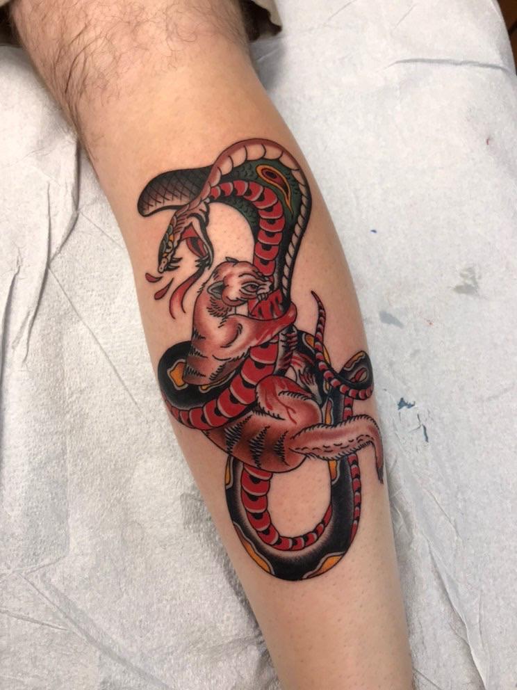 Mongoose fighting a cobra. Done by Ian Scurlock at Monument Tattoos in
