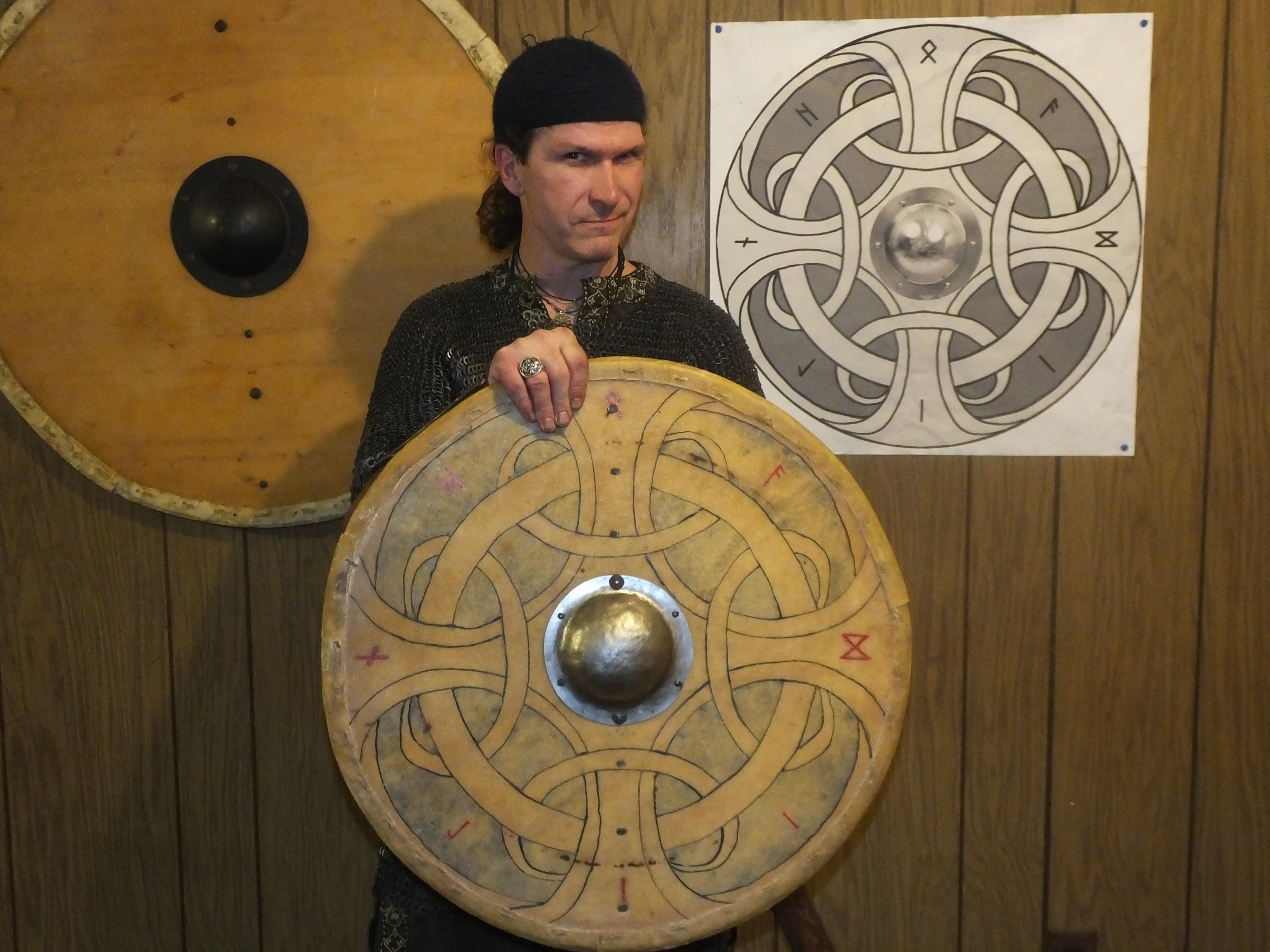 Viking age Linden wood shield covered in rawhide back and rimmed with