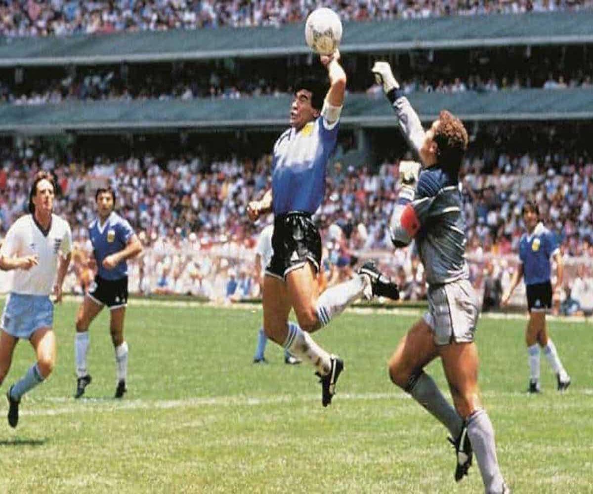 Diego Maradona scoring a goal with his hand against England in the 1986
