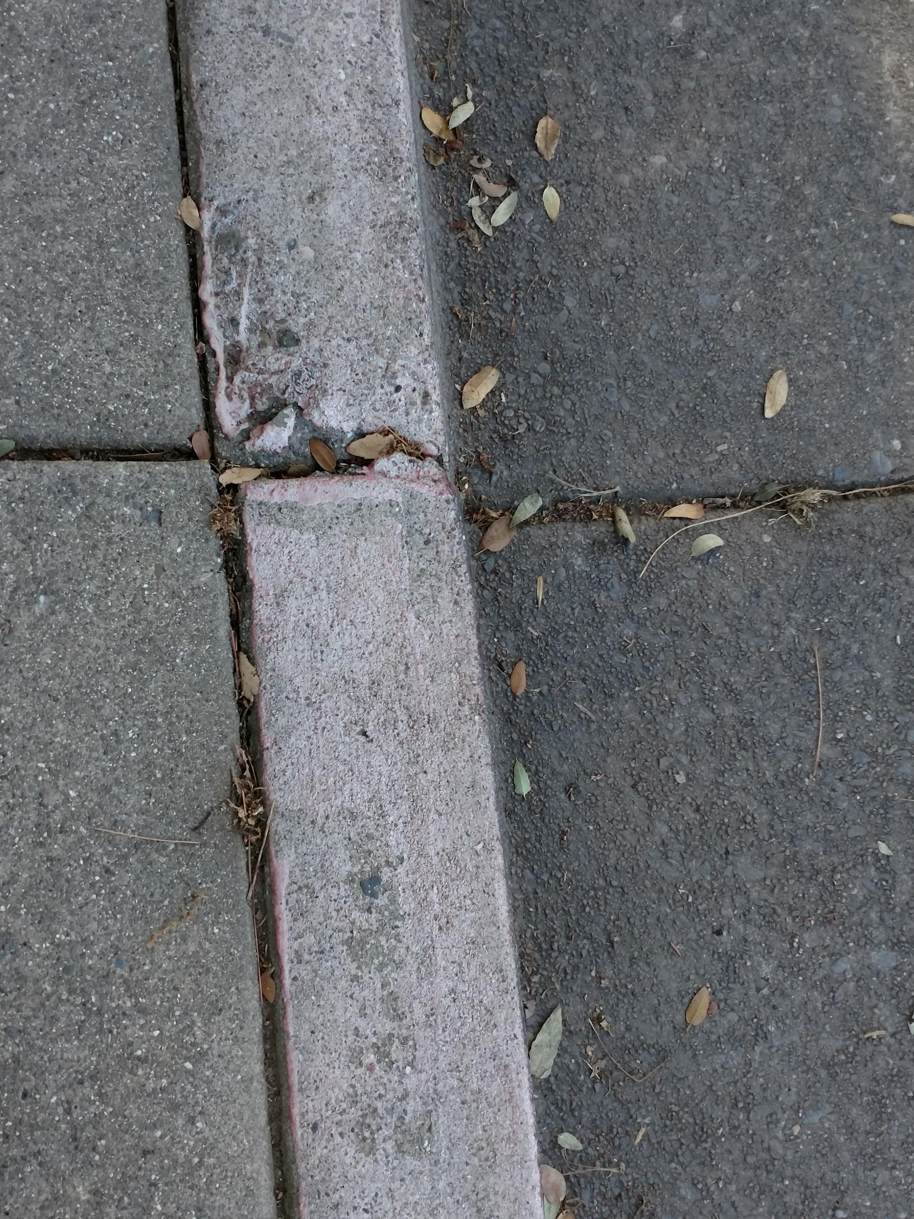 Can you park here where there's a faded red curb? Is it a fire lane? Or