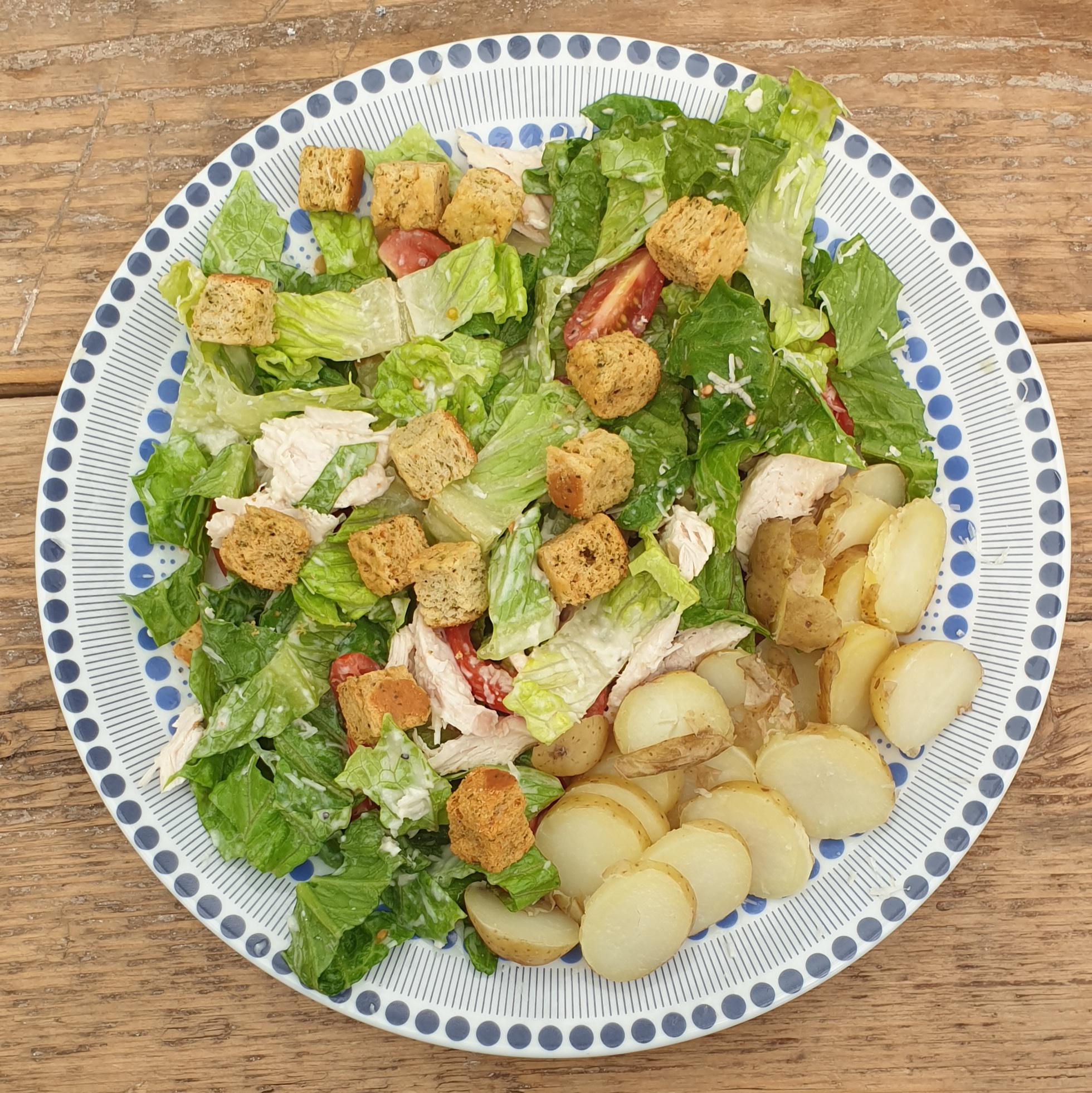 Chicken Caesar Salad with a side of potatoes for 390 cals Volumeeating