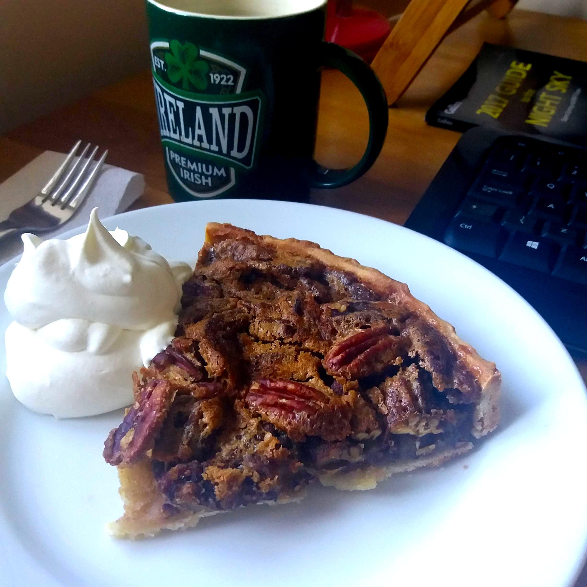 Homemade Pecan Pie with some whipped cream. A delightful company of my