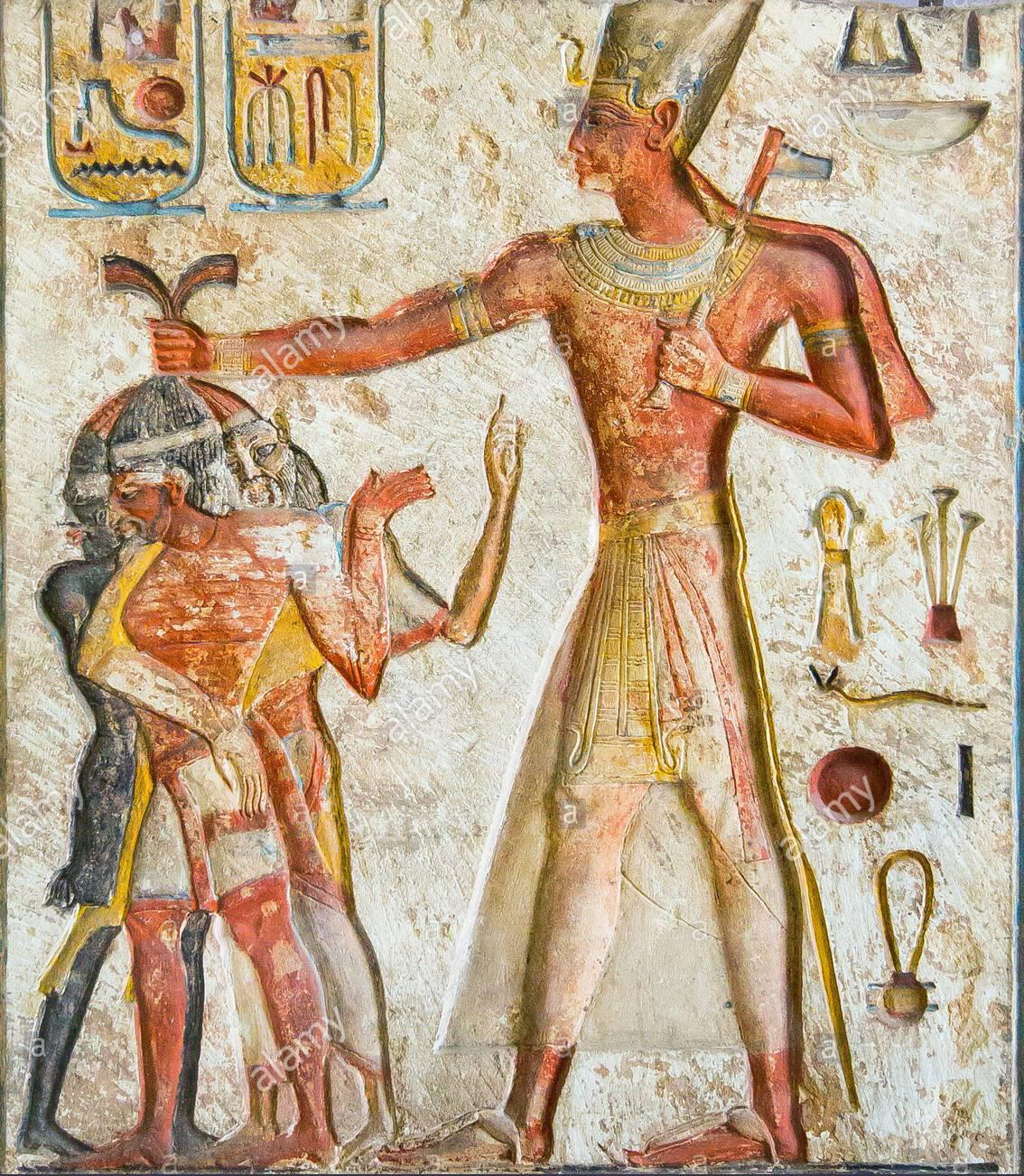 Relief of King Ramses II killing enemies of Egypt, a Nubian, a Libyan