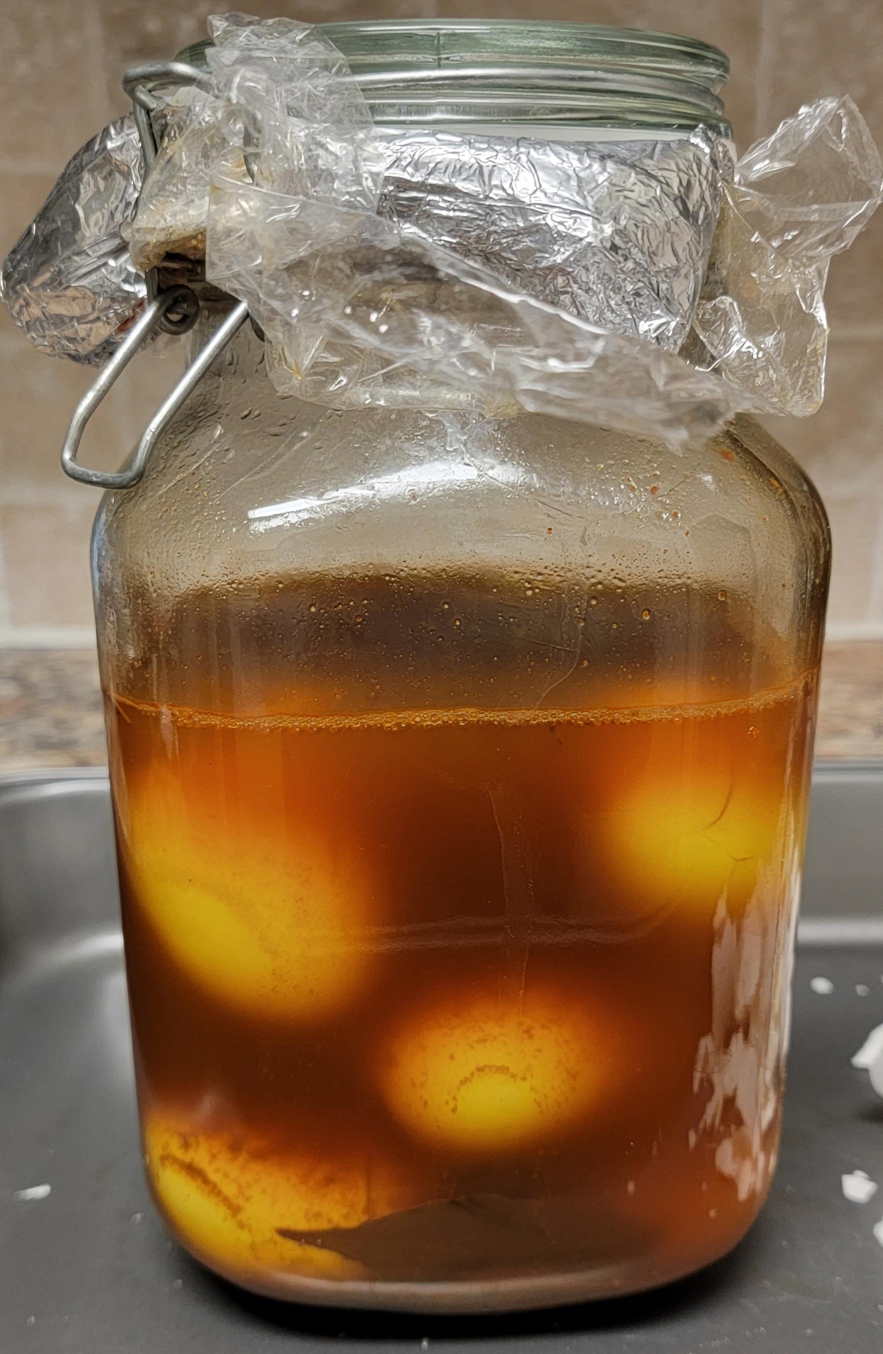 Eggs pickling in vinegar, red wine vinegar, worcestershire, tumeric