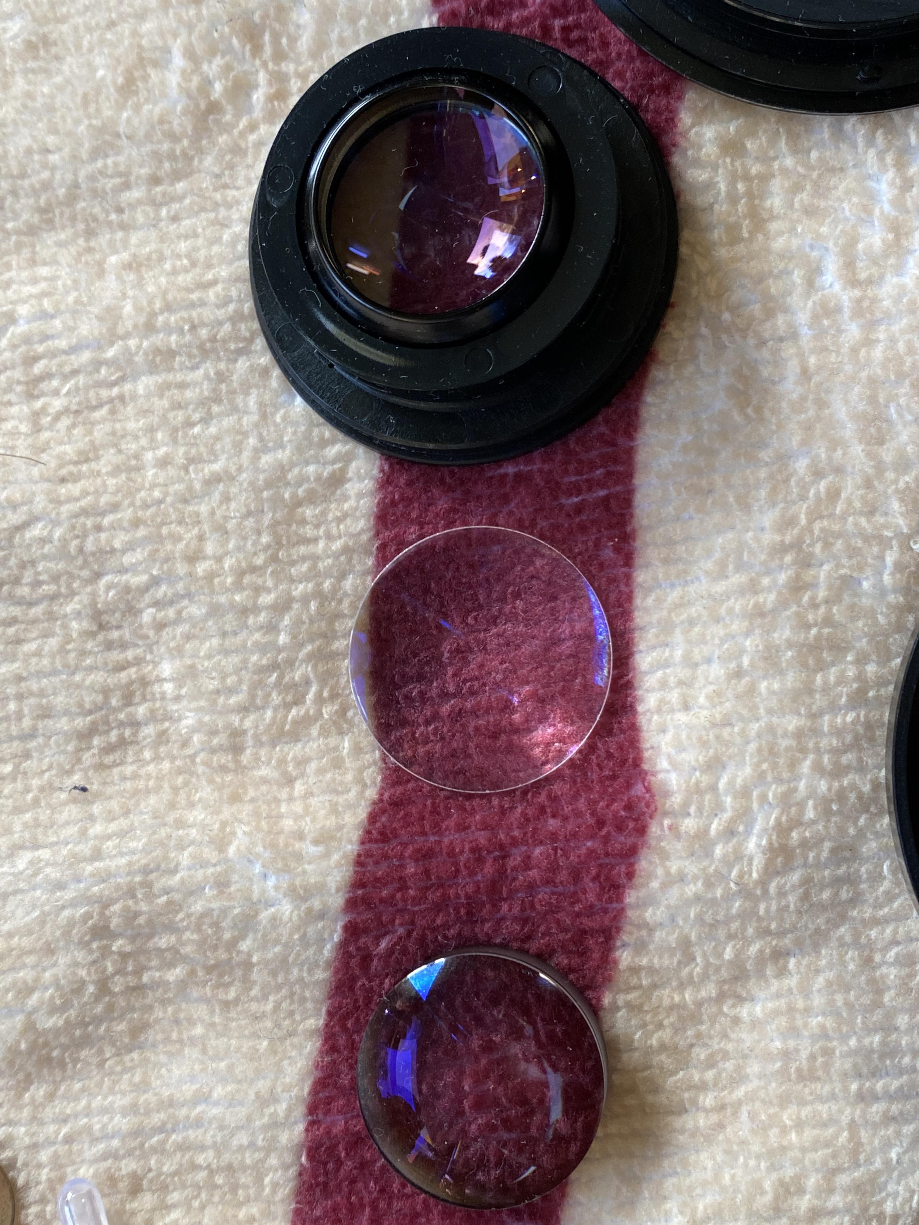 I am currently trying to clean these lens pieces. Which chemicals