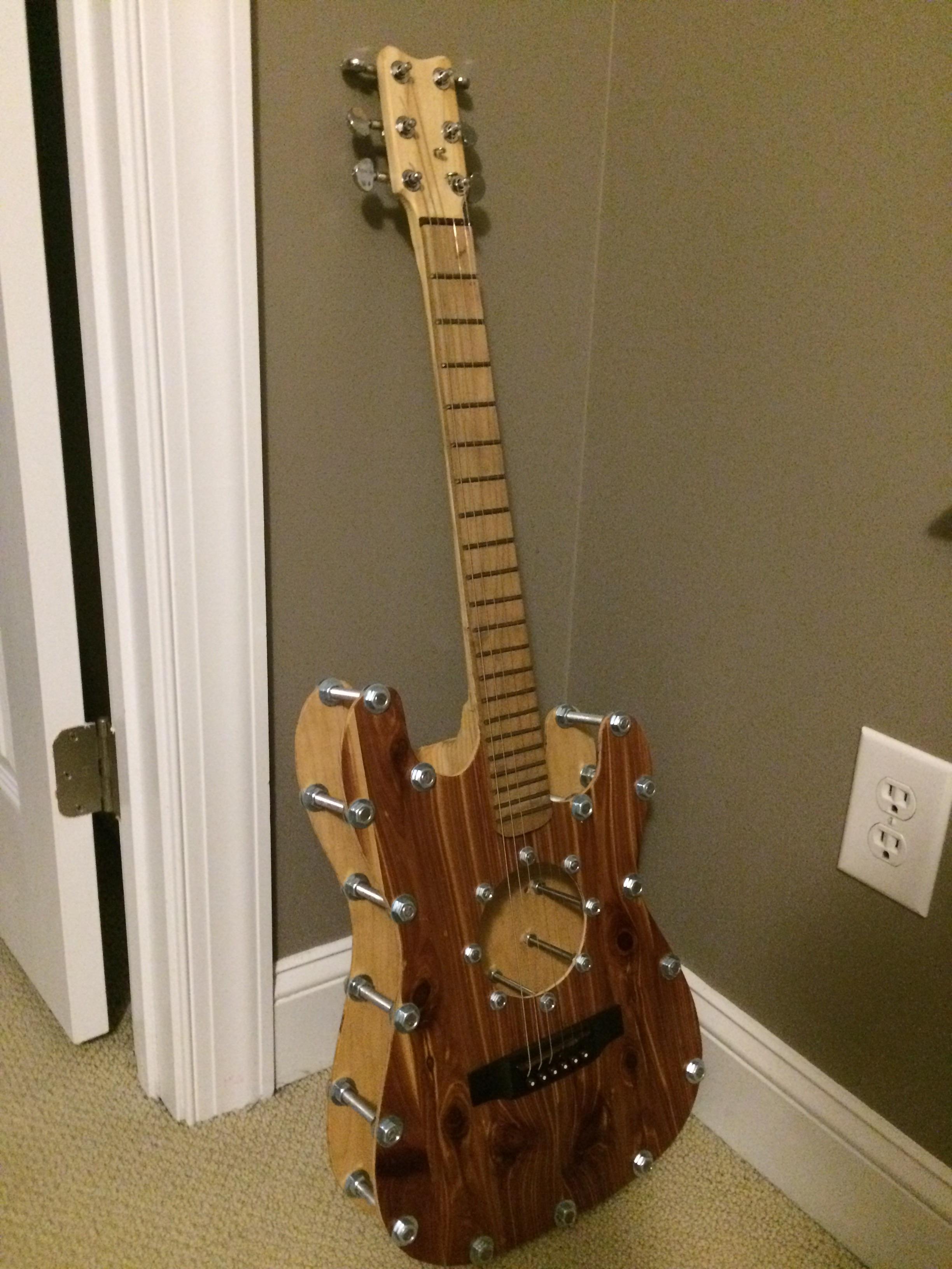Here is my working home built guitar. Everything is handmade except for the bridge and the