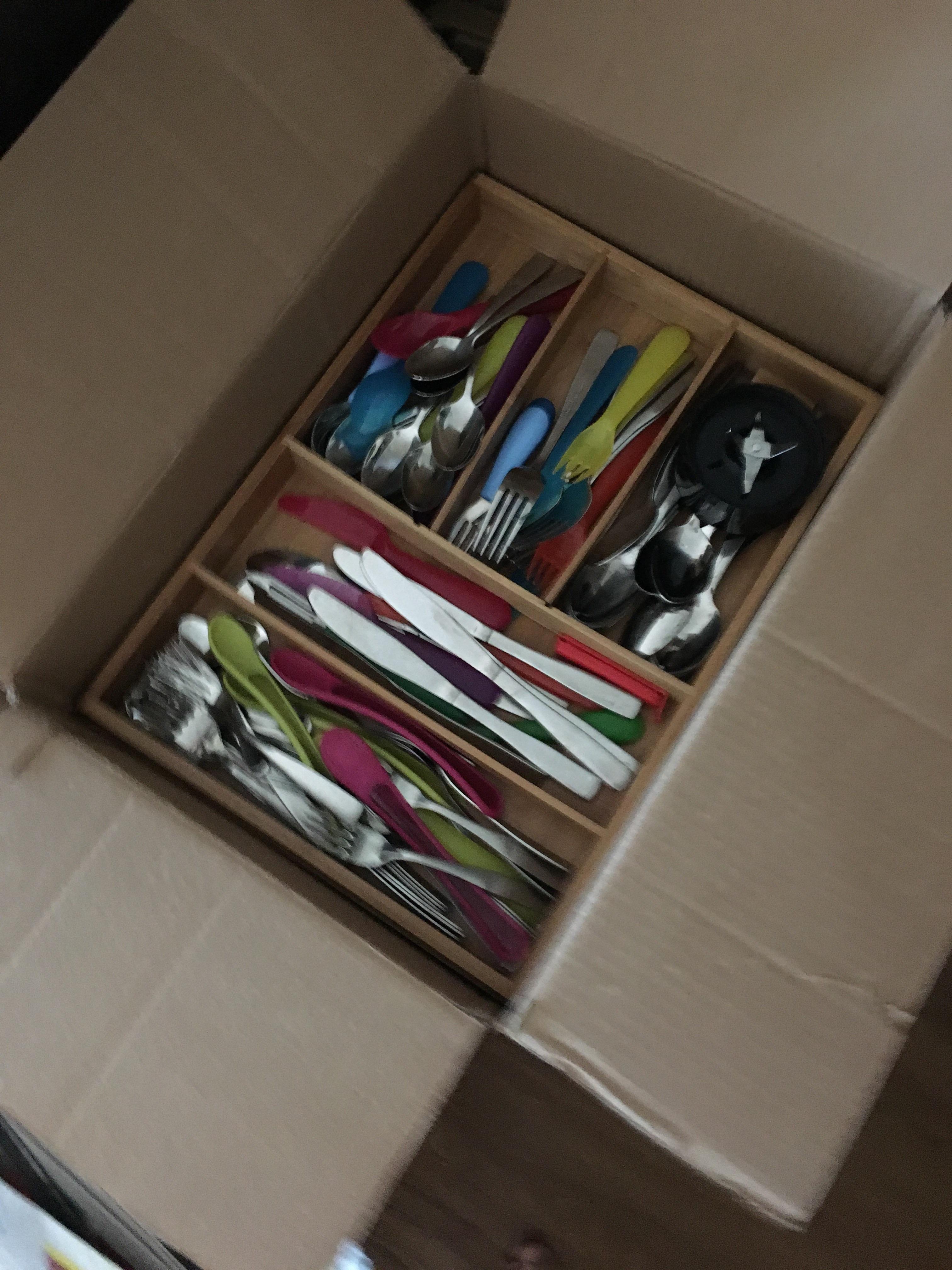 Packing moving boxes and my cutlery tray fits perfect into this random