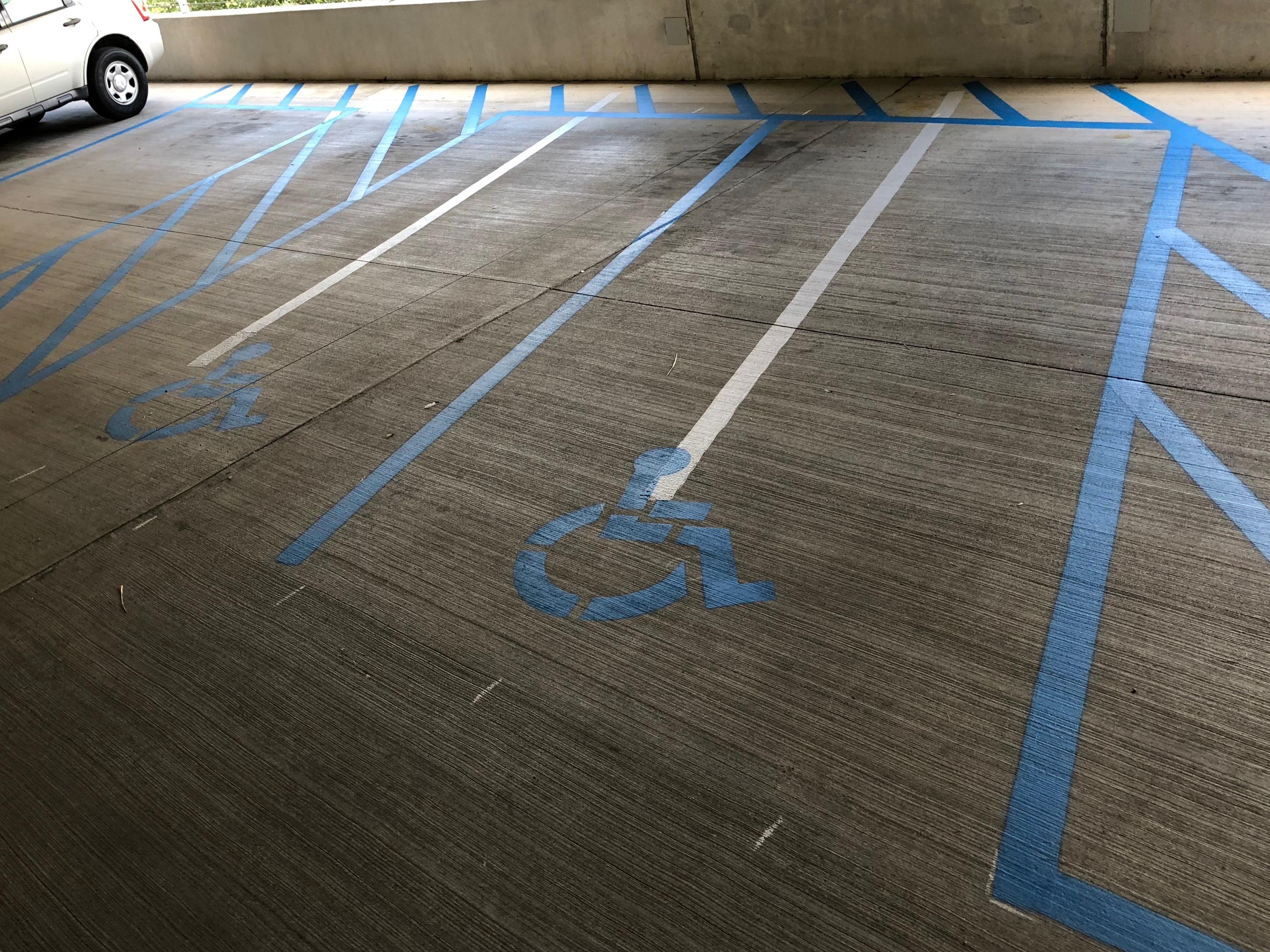 Paint new parking lines done. Remove old parking lines not on the