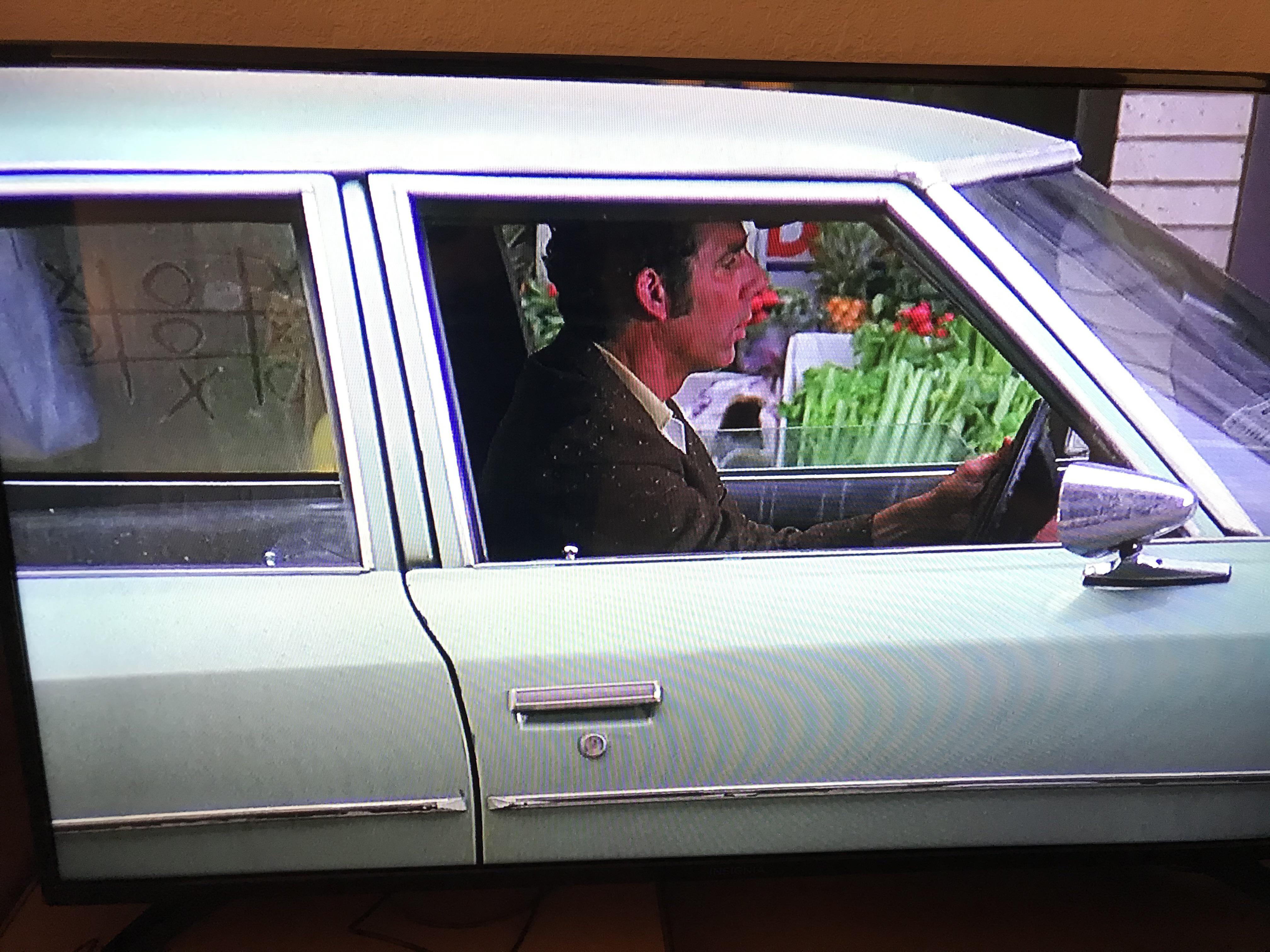 Kramer’s car is so dirty that someone played a game of tic tac toe on