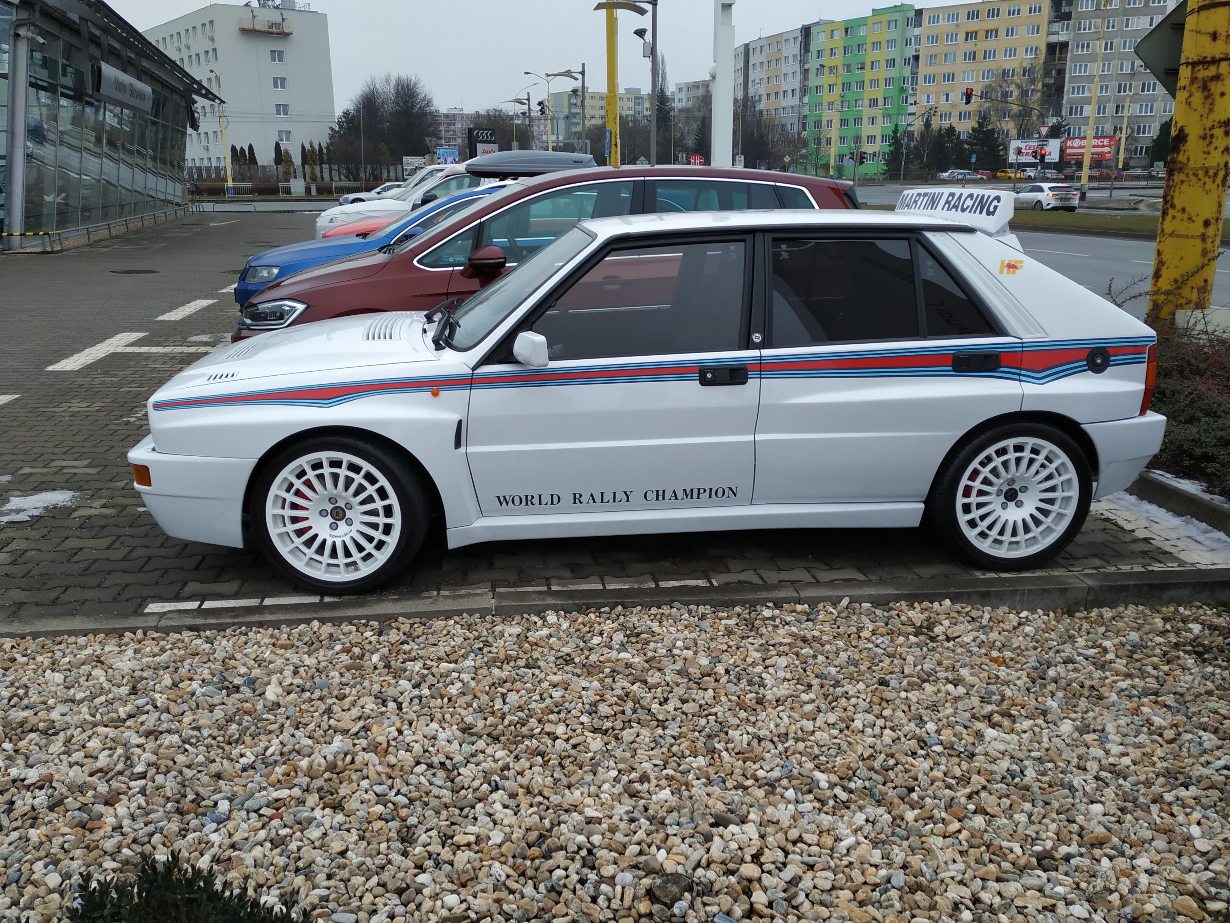 [Lancia Delta HF Integrale] at a car service shop. A used car