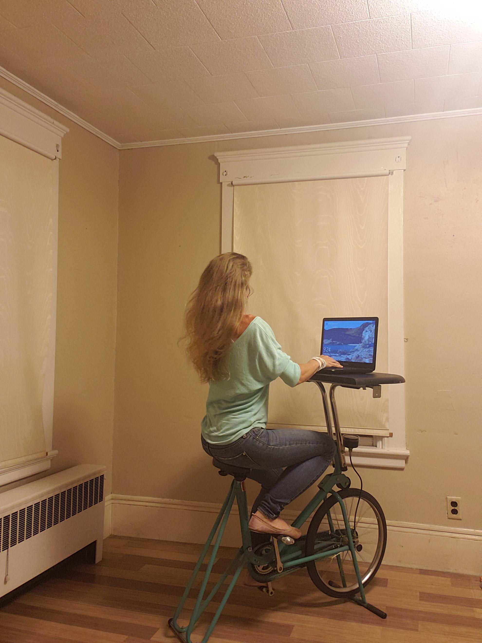 I turned an old exercise bike into a laptop desk, it even swivels. r