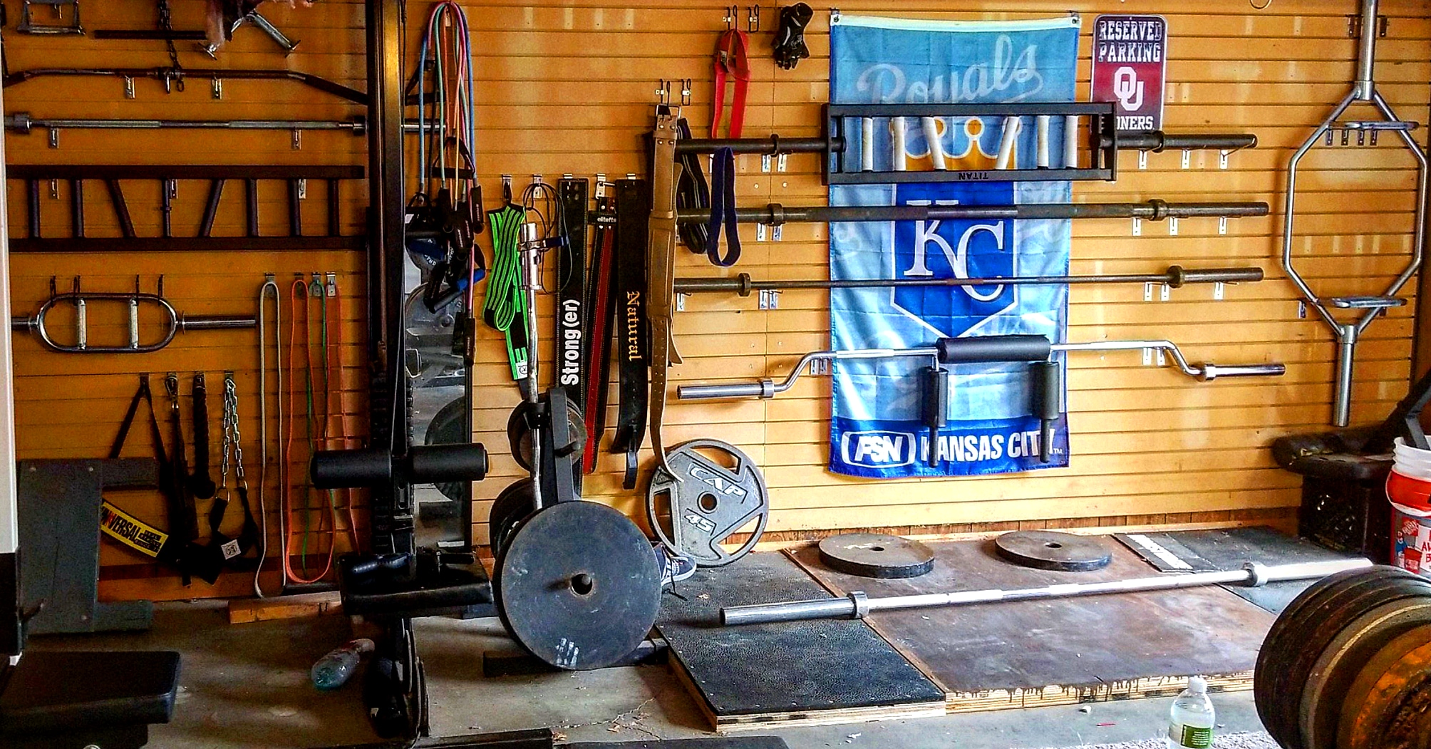 My home gym barbells and attachments. Still trying to organize it just