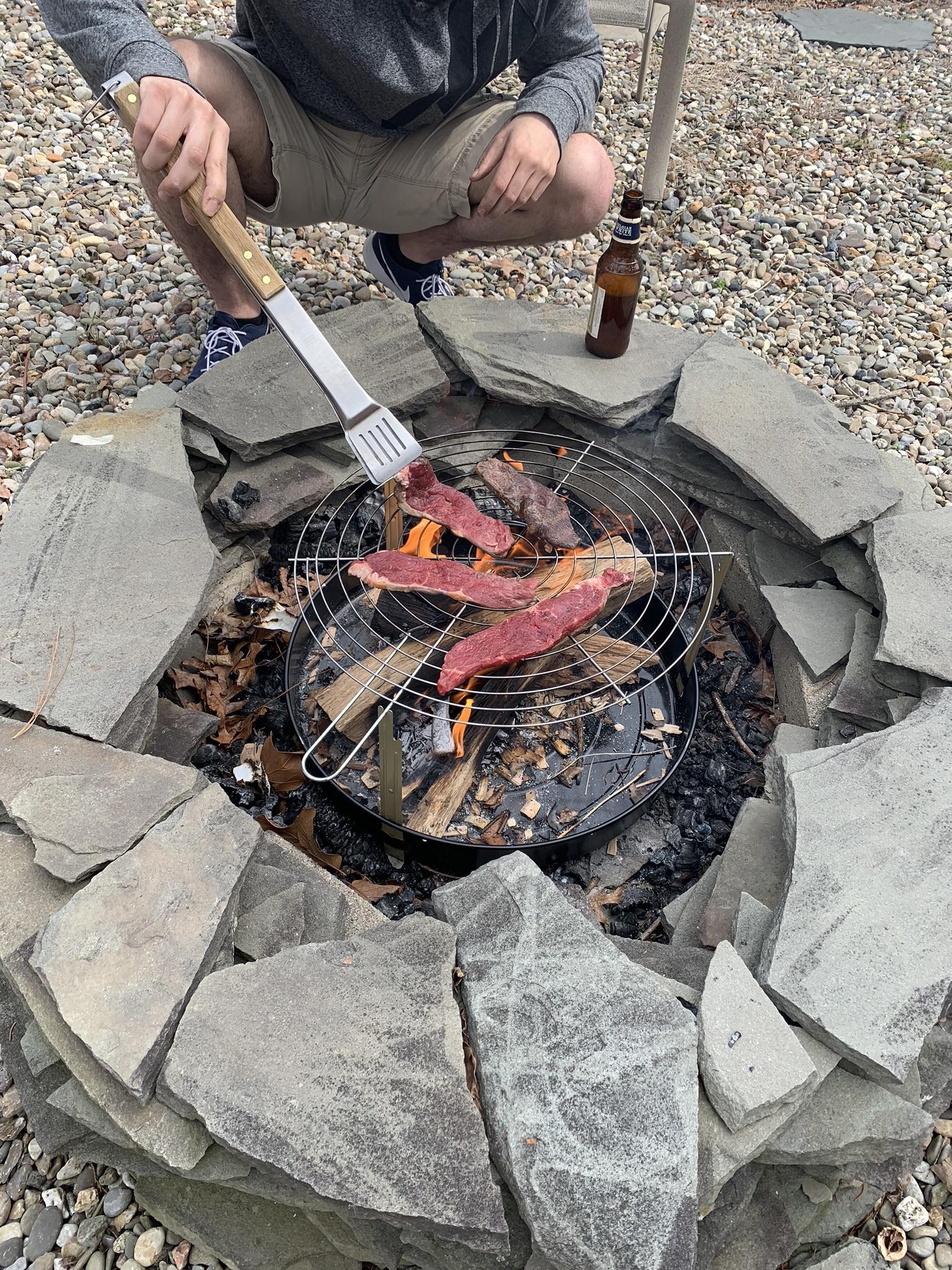 Over the fire pit grilling