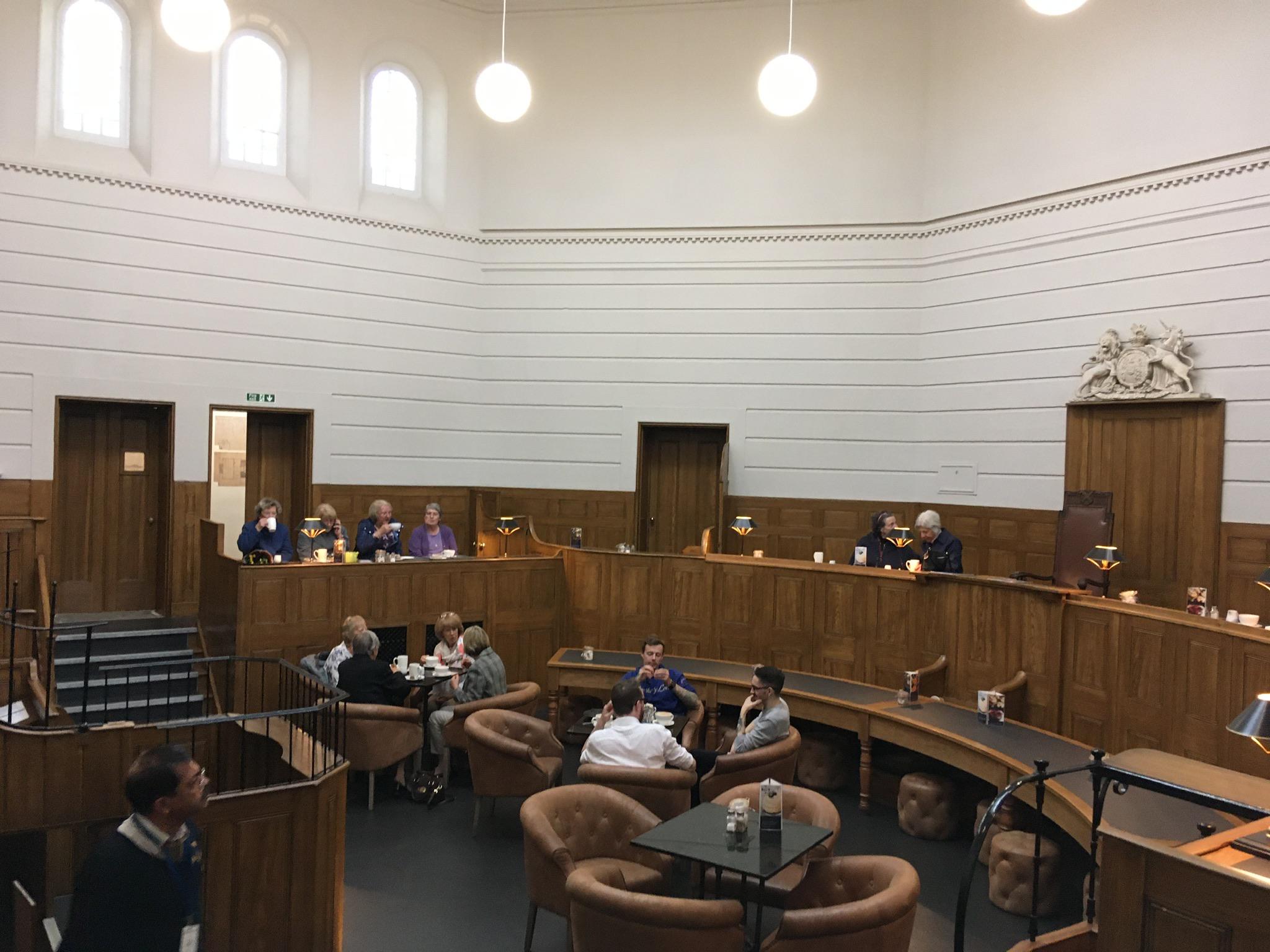 Court room that’s now a cafe. Cells are the toilets. St. Albans, England. r/repurposedbuildings
