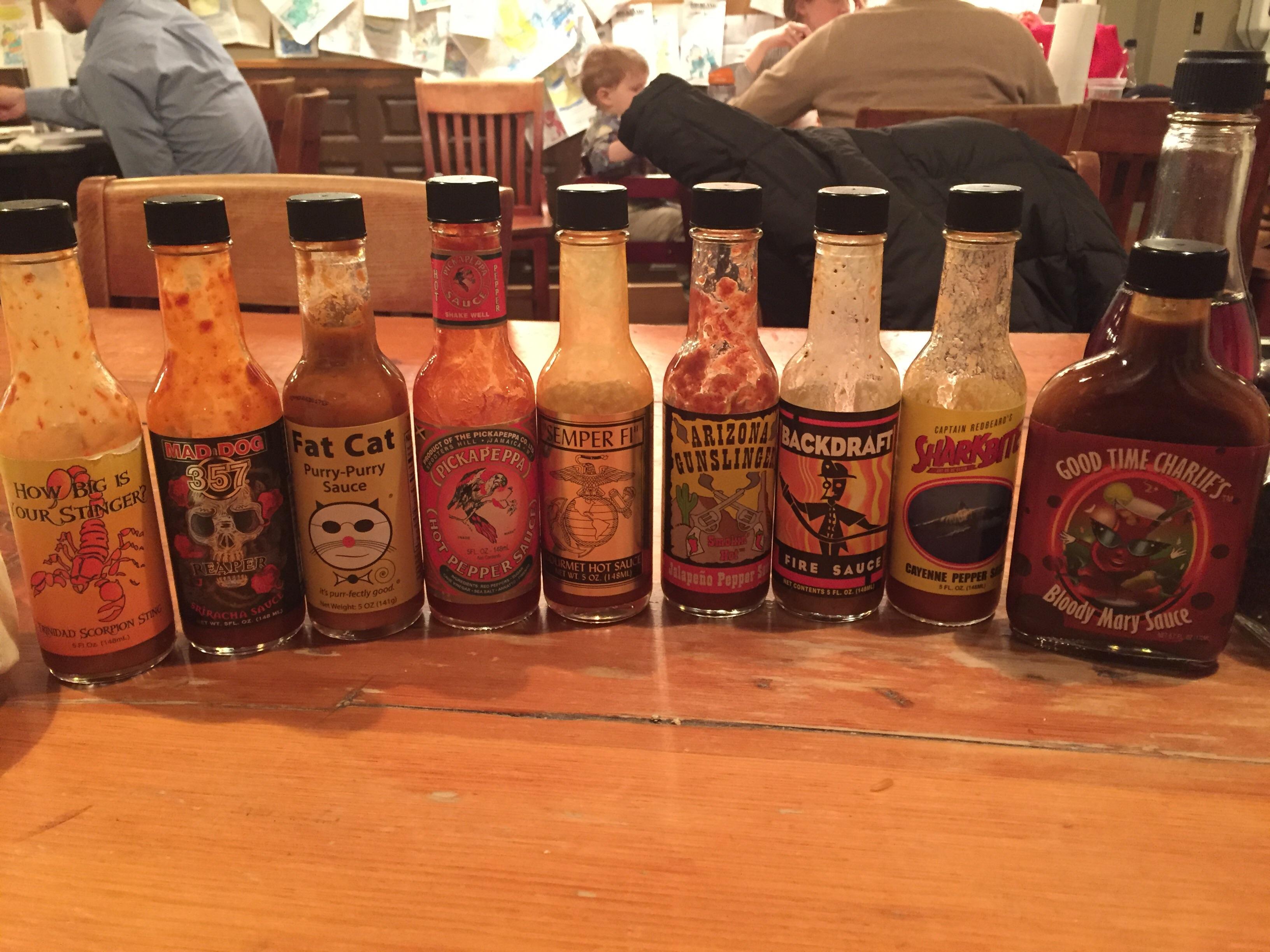 Hot sauce selection at a local BBQ joint r/spicy