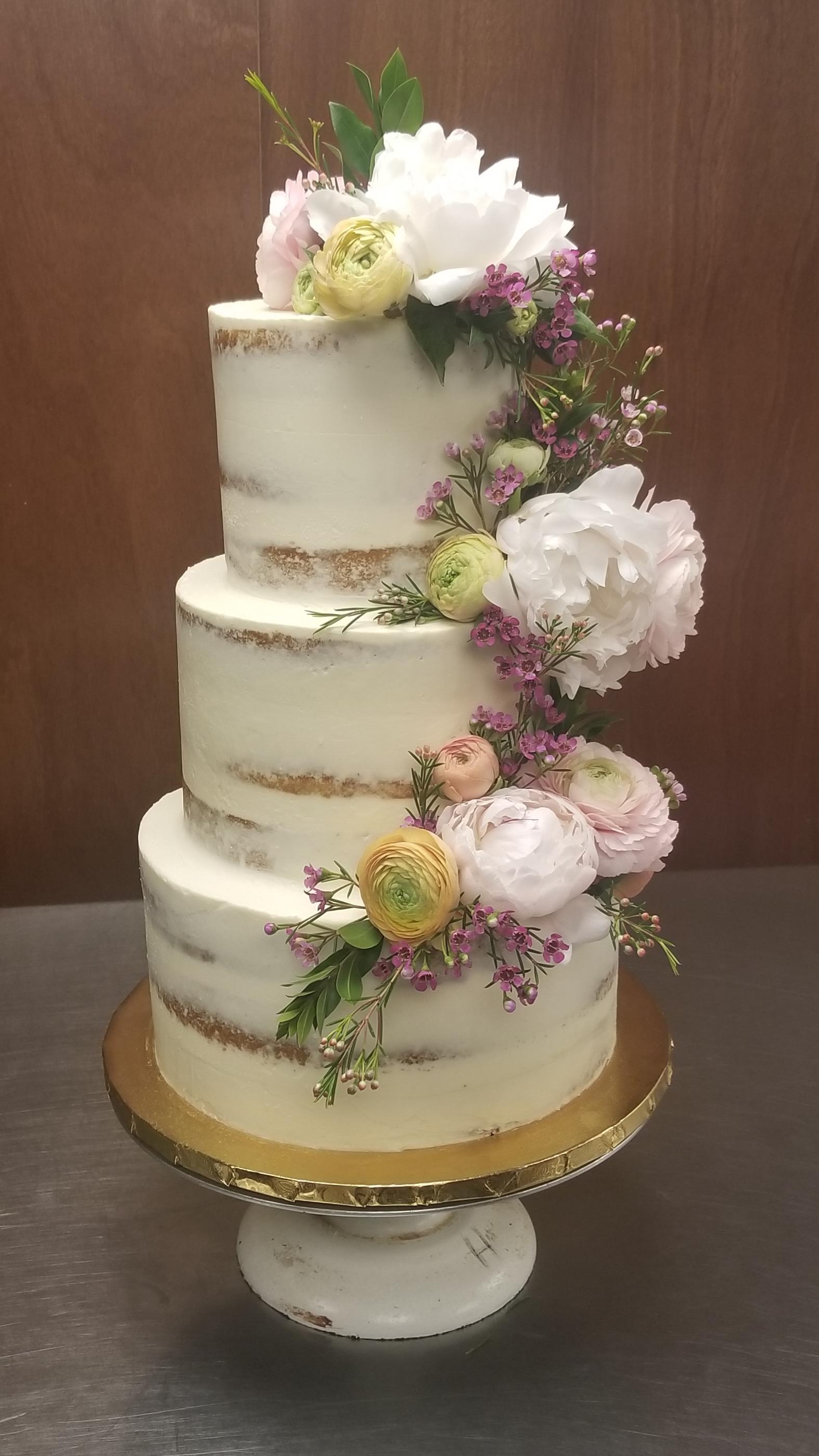 Naked wedding cake! The cake, not the guests. Baking