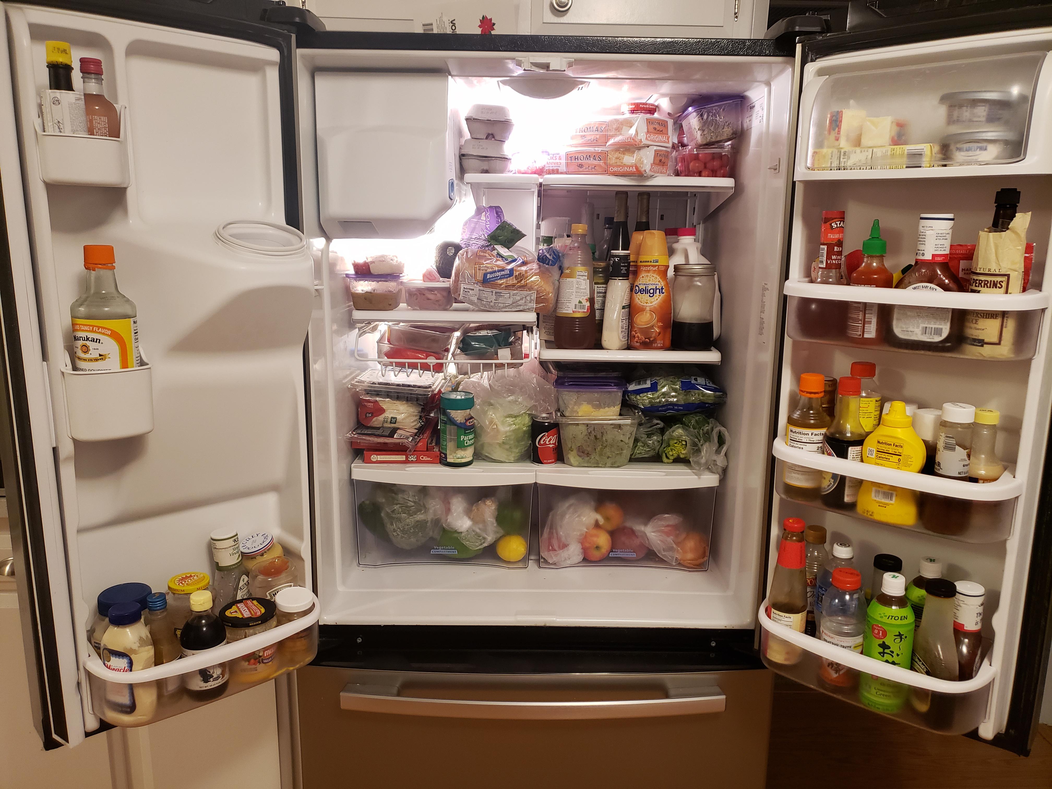 Over full holiday fridge. r/FridgeDetective