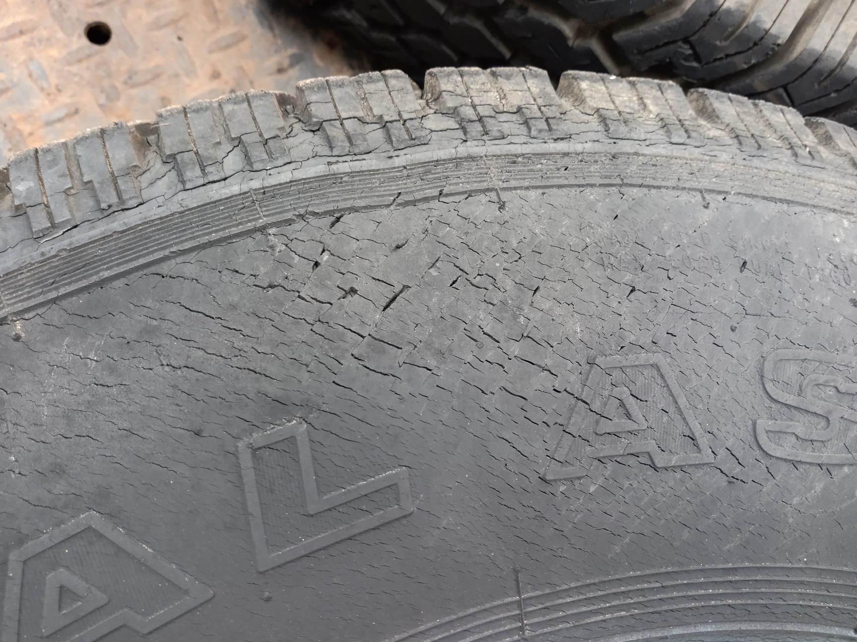 Dry rotted tire with this crystalline fracture pattern on the entire
