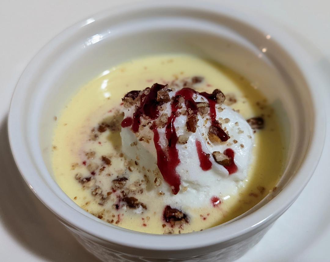 Floating Island Poached Meringue on Creme Anglaise with Raspberry