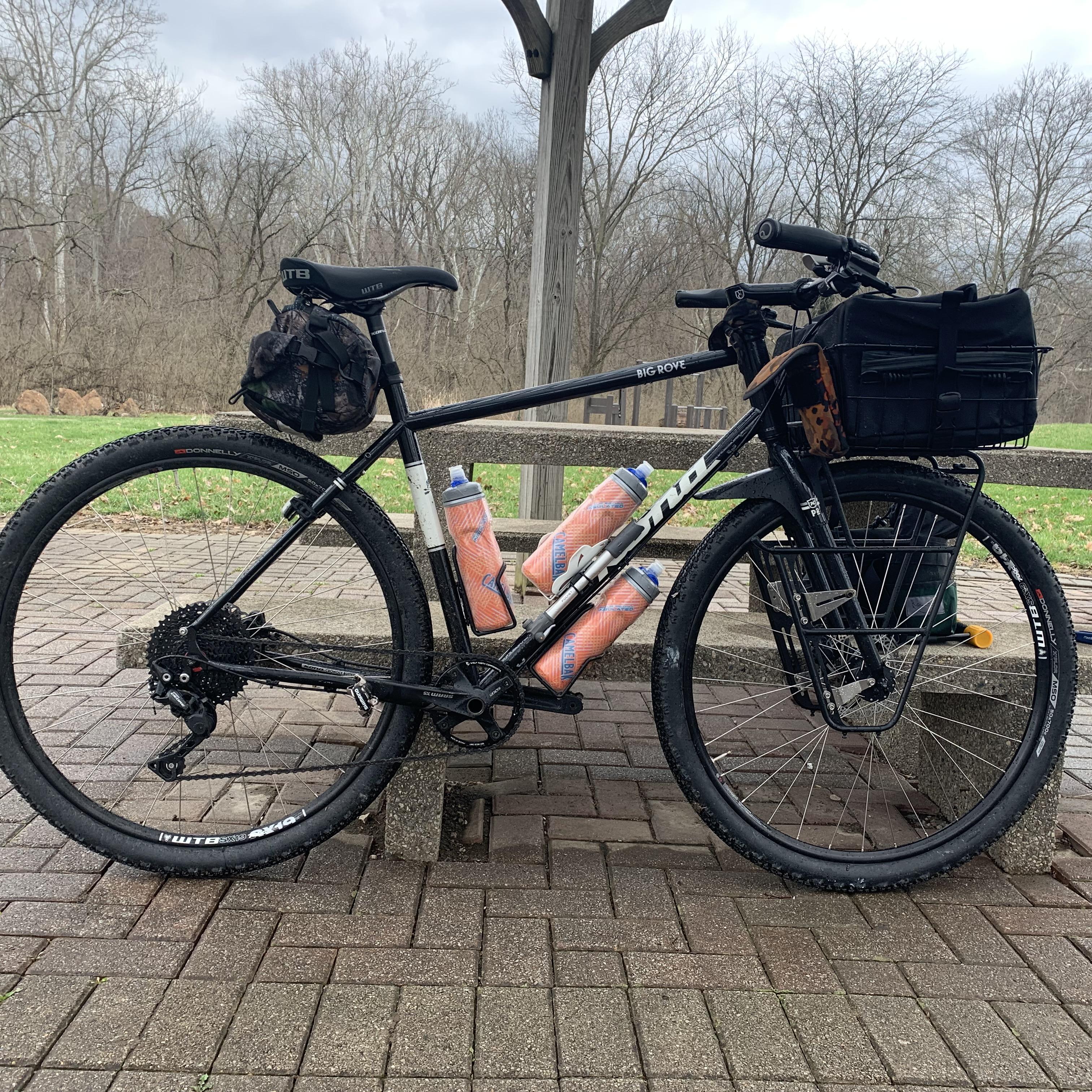 Kona Big Rove set up 1x10 with a surly front rack, walk 139 basket and
