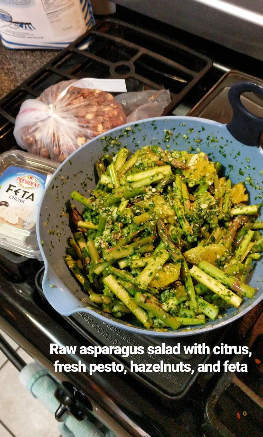 Raw asparagus salad with orange, fresh pesto, feta, and hazelnuts r