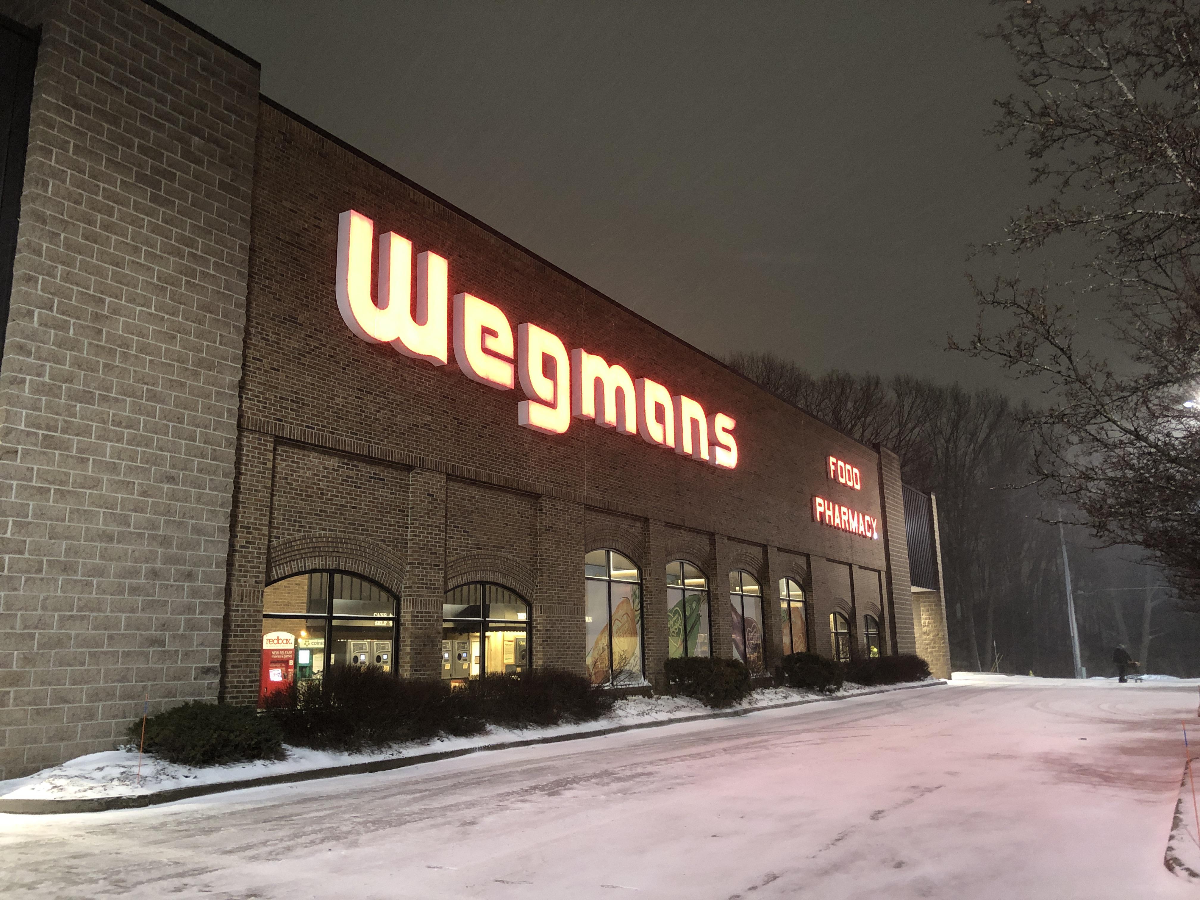 On a dark snowy night an electric warmth shines through. Store 33