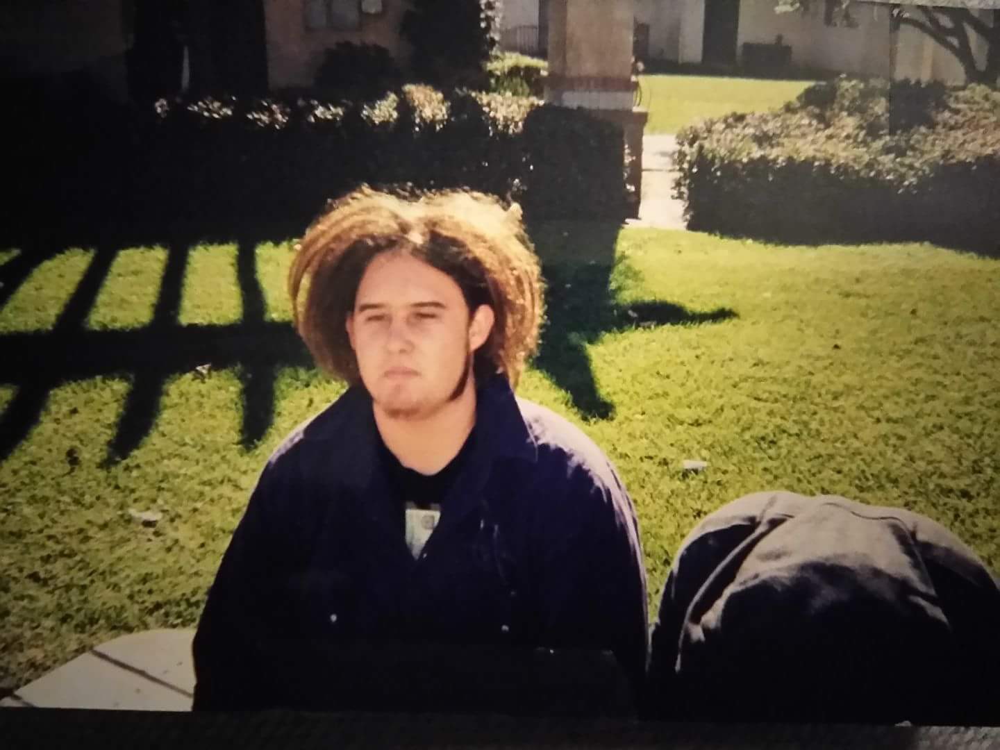 18yrs old with Dreads, big sideburns, and goatee....circa 2002, San