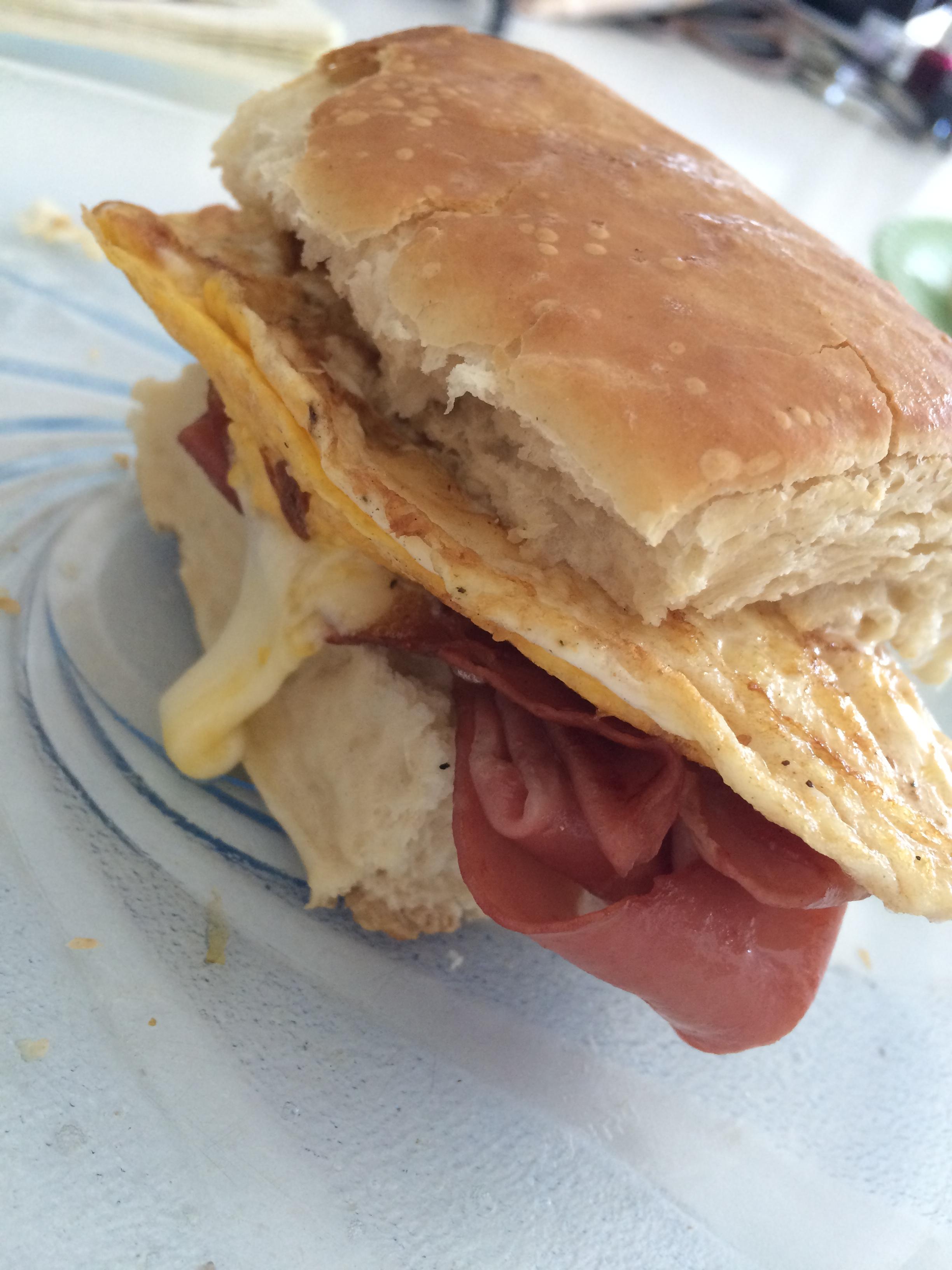 Fried mortadella / fried egg / mozzarella on a toasted roll with mayo