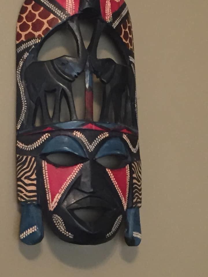 An authentic hand carved Maasai Mare mask w/ African elephants, hand