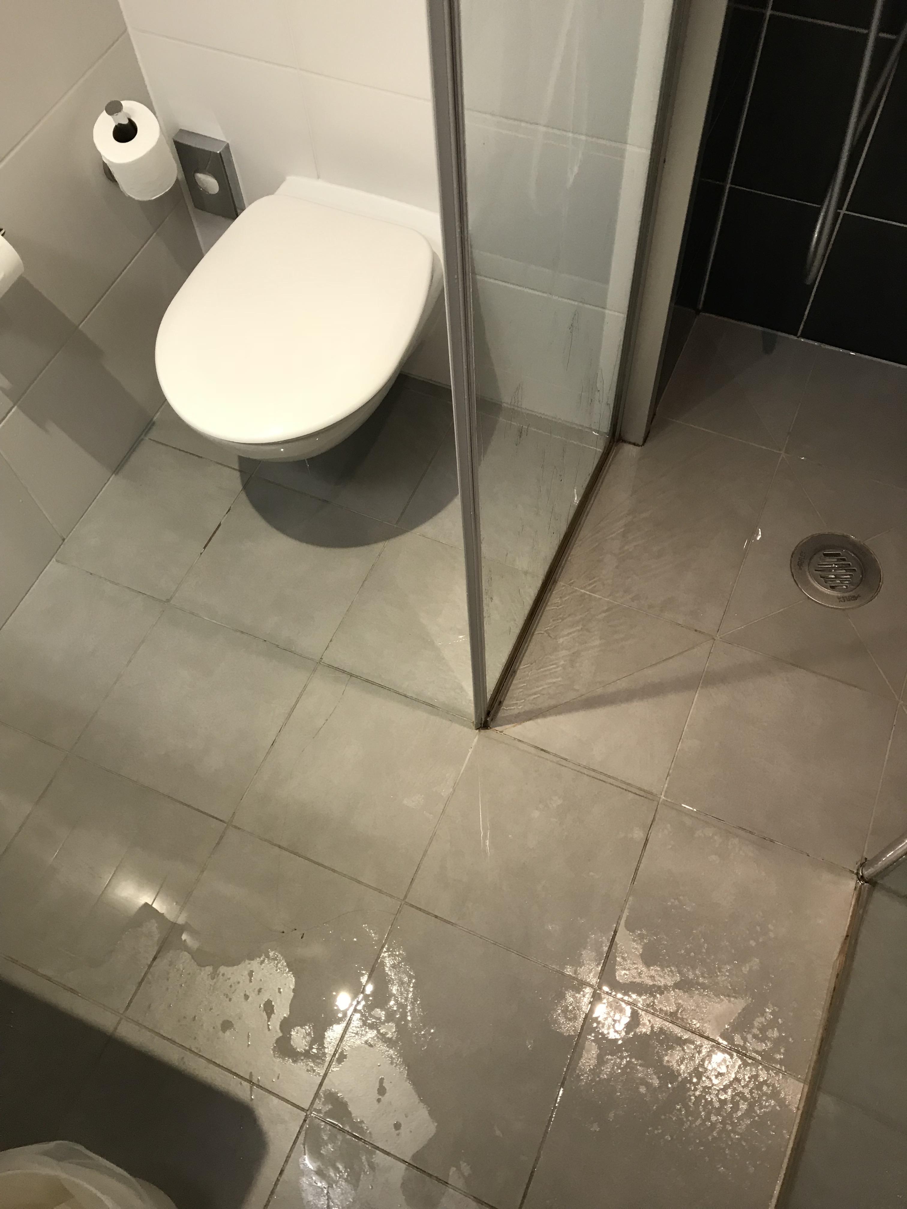 A shower with no base and a crappy seal + a floor that slopes away from