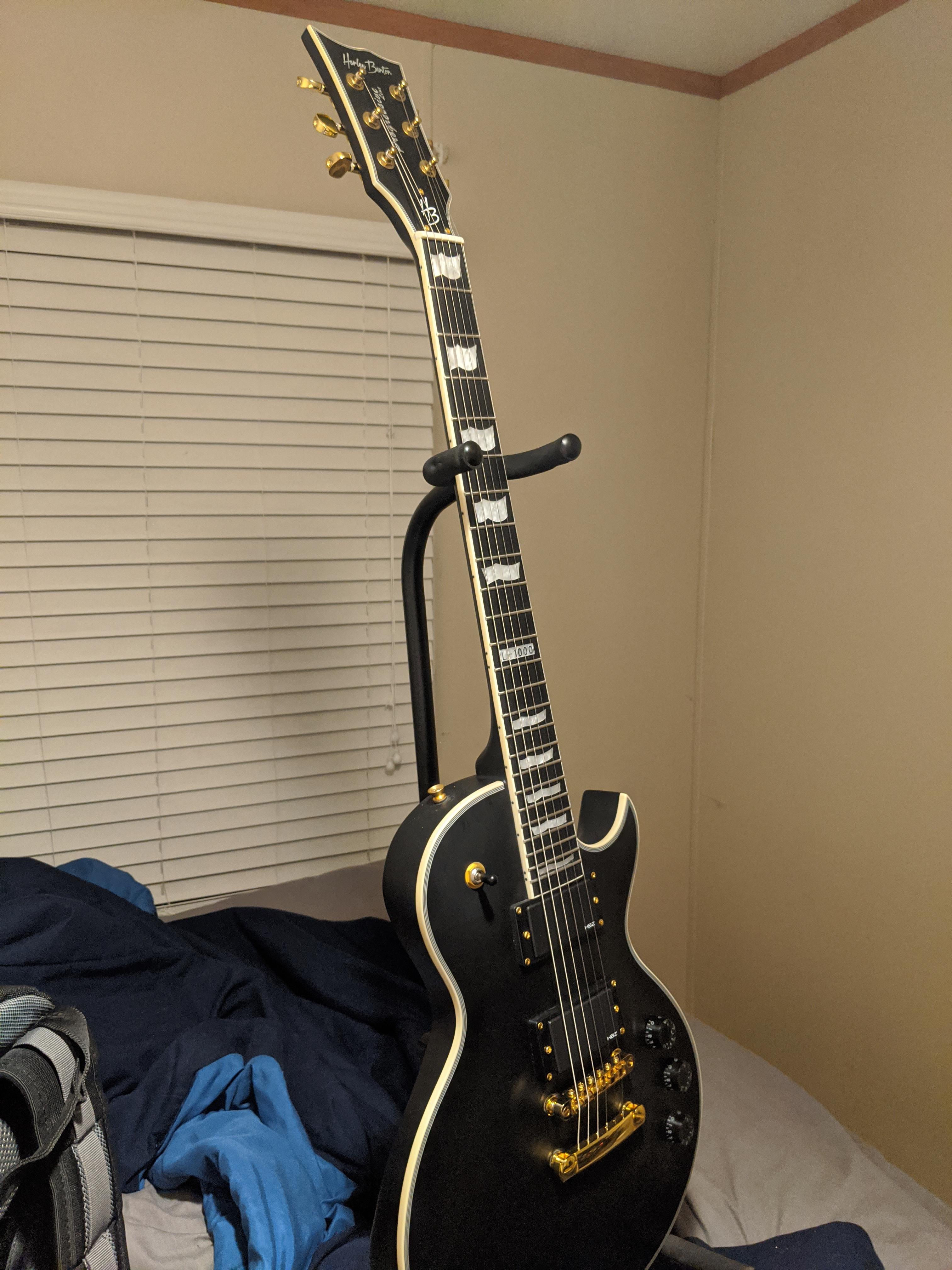 My first guitar showed up! Harley Benton SC1000V. Now I just need to learn how to play it. r