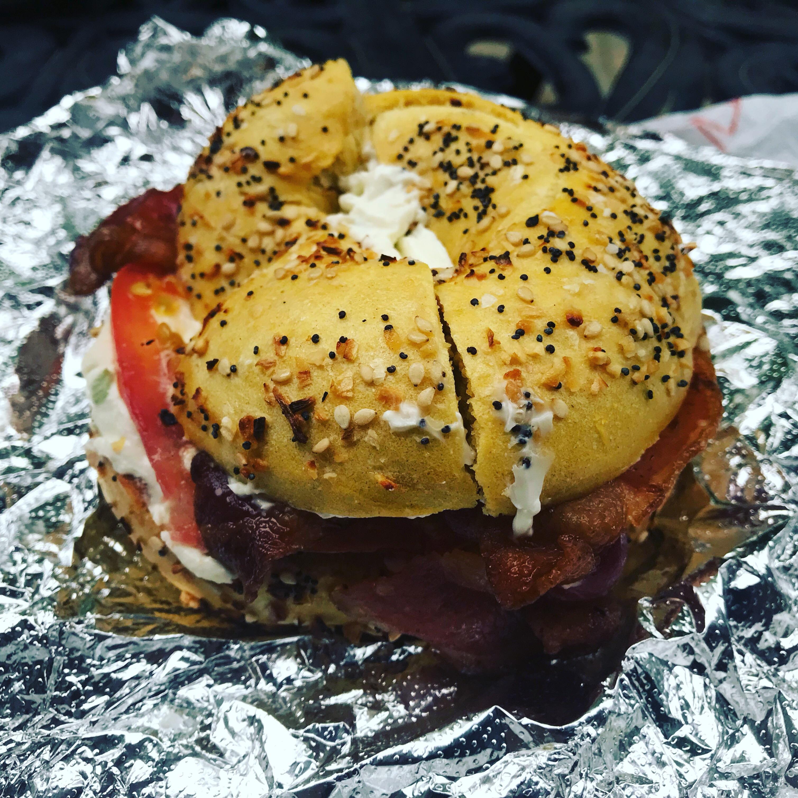 Bacon, tomato and scallion cream cheese on egg everything bagel best breakfast sandwich I’ve