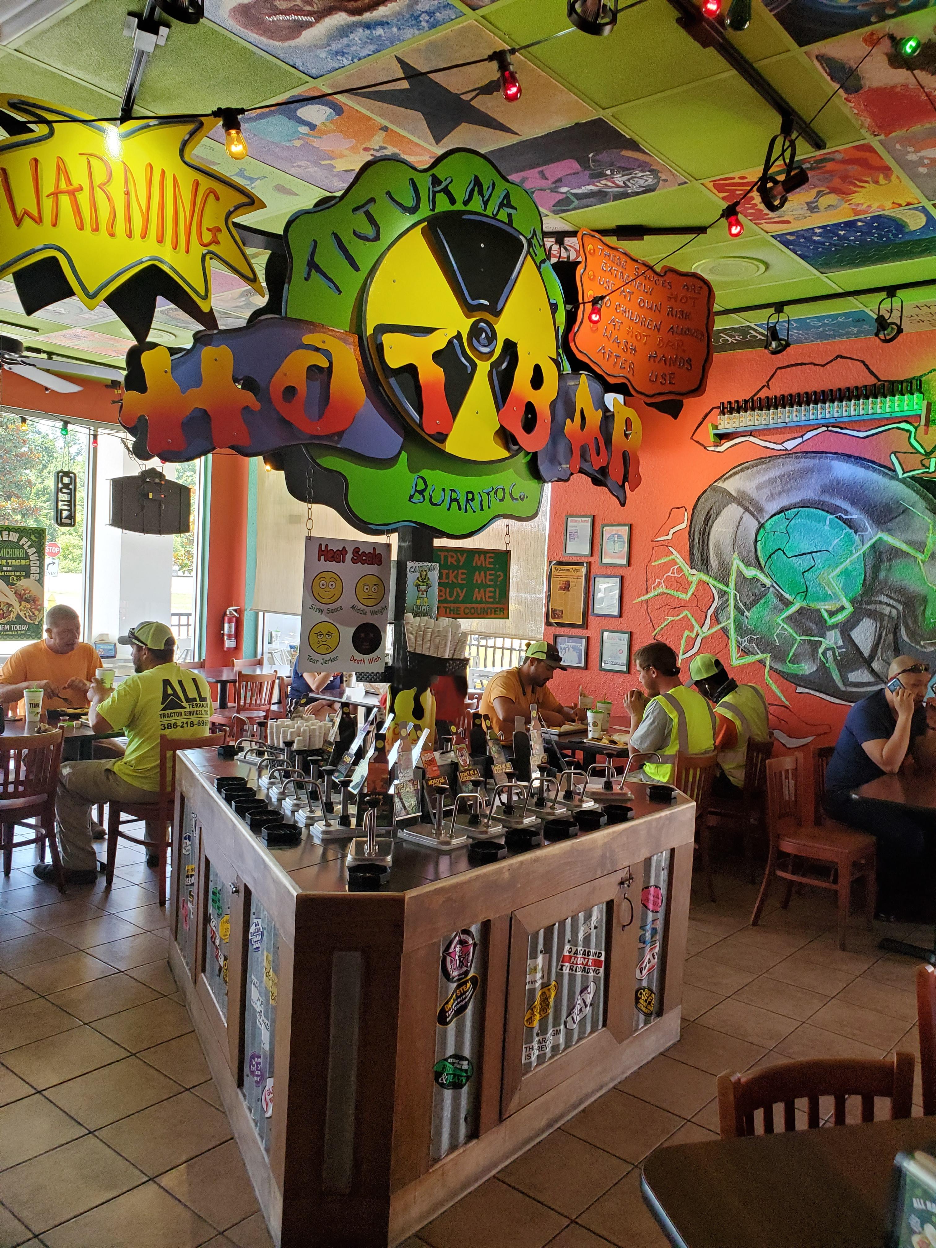 The hot sauce bar at Tijuana Flats. I like to sample them all. r/spicy