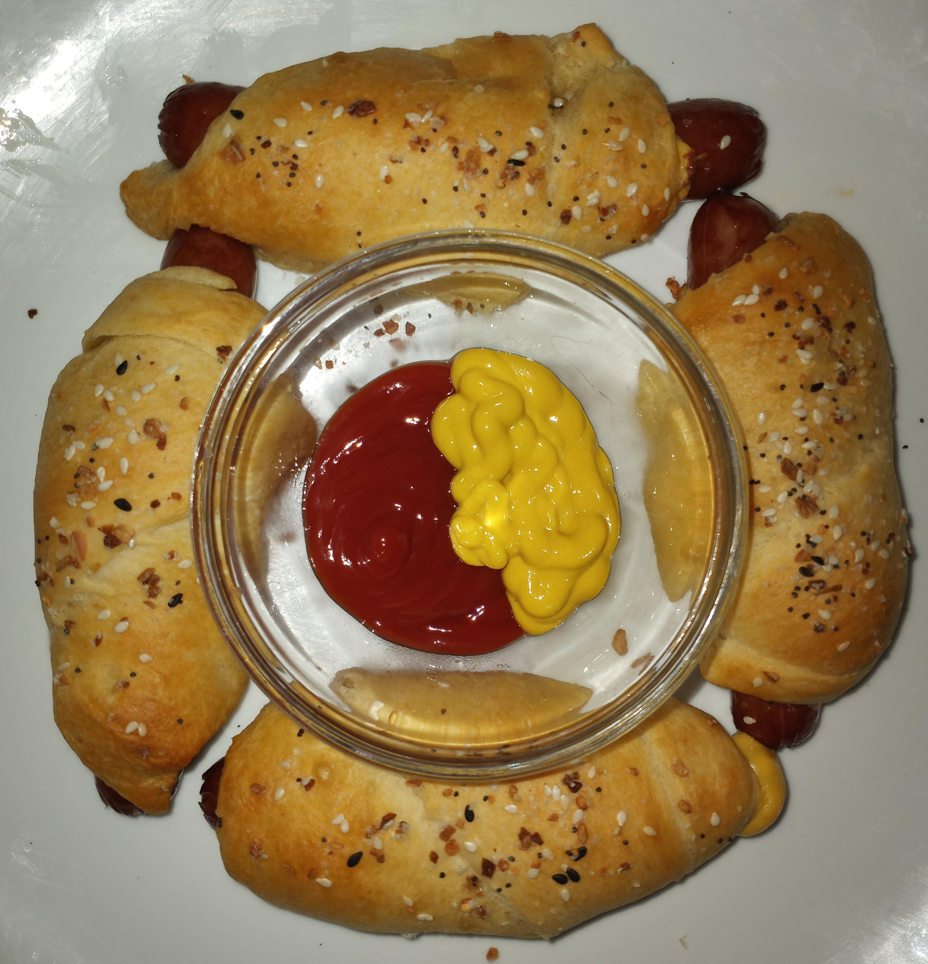 Extra long pigs in a blanket. Two are stuffed with cheddar, one with