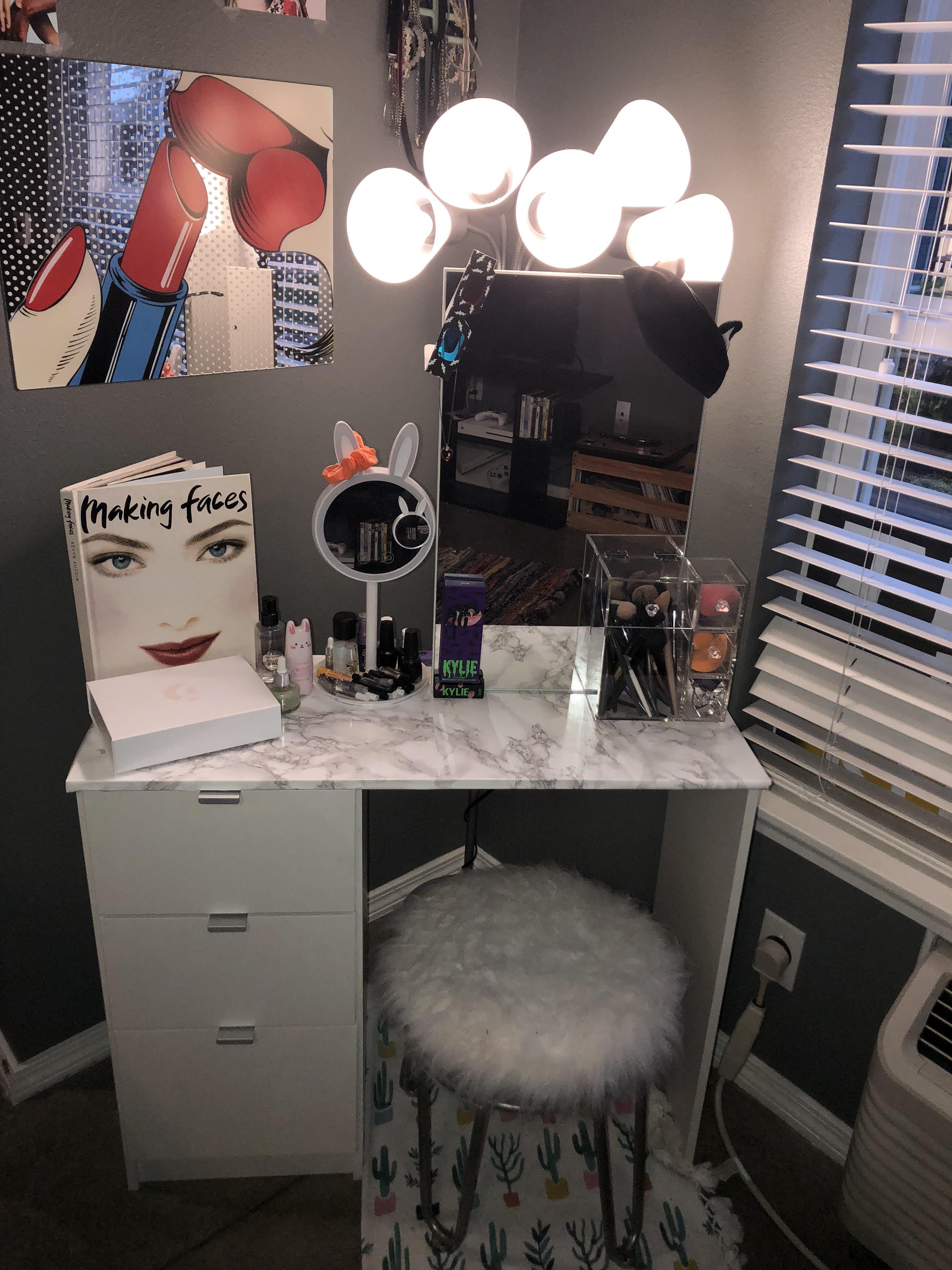 I added marble contact paper to my vanity and I love the way that it